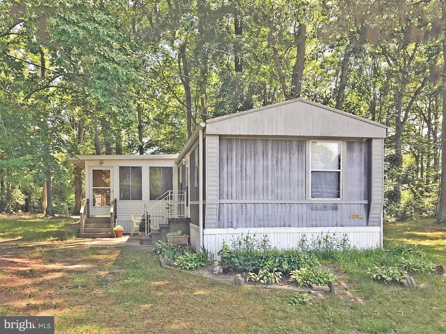 Affordable Price • Reasonable Lot Rent • Low Utilities • Convenient Location! Calling all Boaters - Marina Community with a boat ramp and slips for rent! And close to the beach, too: the famous Rehoboth boardwalk is less than 6 miles away! Vaulted ceilings in the main living area. Large eat in kitchen w/adjoining laundry area. Spacious 3-season enclosed porch for extra living space. Split bedroom plan is like having 2 main suites. Rear patio area for BBQ'ing, outdoor dining, and entertaining. Big 10’x16’ storage shed for your beach, fishing & gardening gear. Newer heater. Being offered AS IS at this price. Lot Rent $730.35/mt. +$1.50/mt. RTF (Lease renews annually with any increases capped as per 25 Del. C. Sec. 7050-7054). Water and sewer (septic system) are included in the Lot Rent; Homeowner pays electric and LP fuel. The community owner requires an Application from the Buyer, with acceptance based on the following criteria: 1.)income verification, 2.)credit bureau score, plus evaluation of debt-to-income ratio, and 3.)criminal background check. (Note: Family & friends may always visit, but rentals are NOT permitted, and Love Creek has pet restrictions.) Financing may be available to qualified borrowers from only a few Lenders that specialize in installment/chattel loans for manufactured homes on leased land. Closing costs will include a 3.75% real estate transfer tax (DMV Doc Fee) & a Settlement Agent fee.