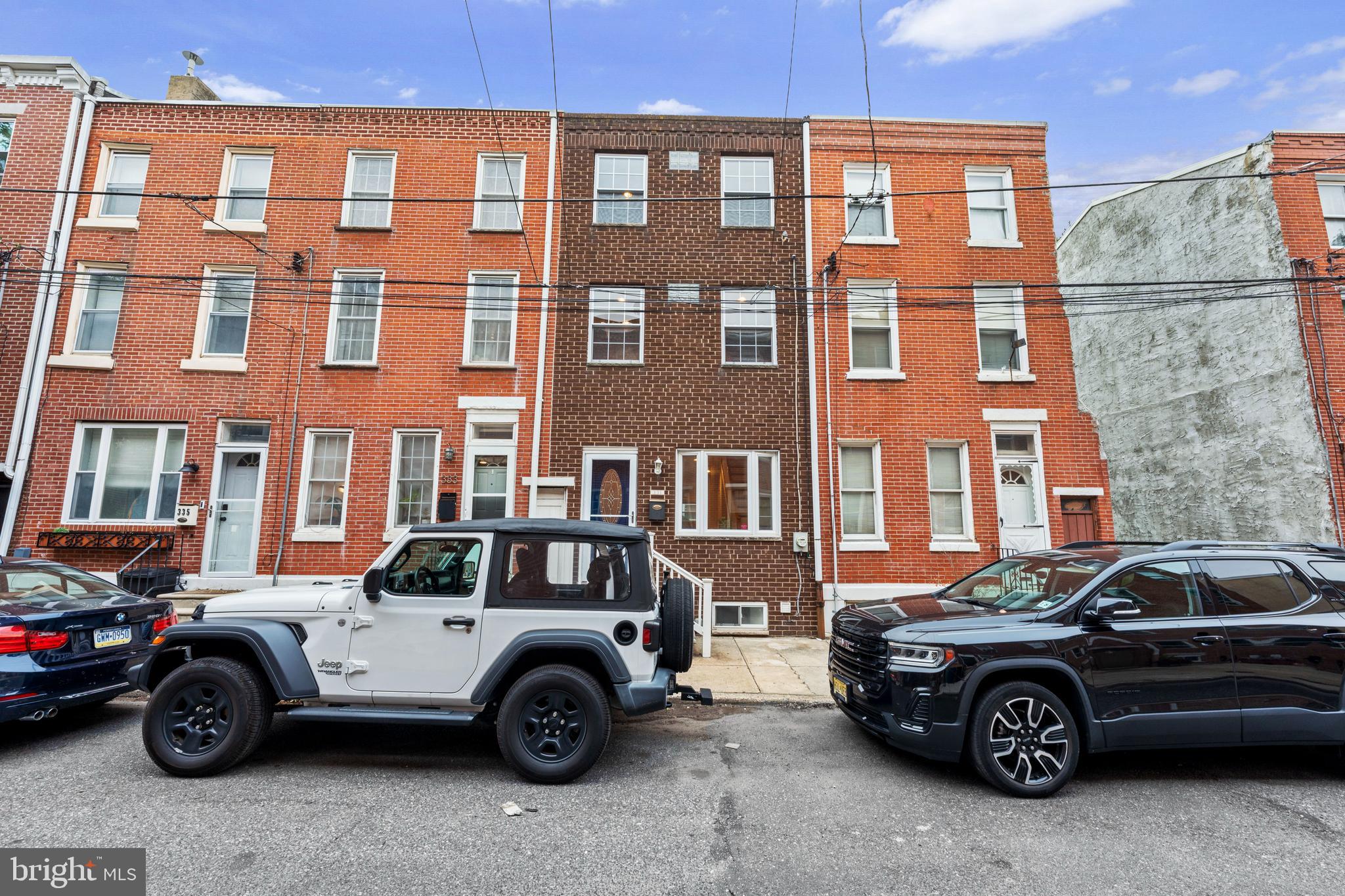 Welcome to 331 Titan Street, a fully renovated home on a quiet street in the booming Pennsport neighborhood of South Philadelphia. Updated top to bottom in 2012, it features newer wiring, PEX plumbing, a brick façade, roof, windows, and a full HVAC system, move-in ready with modern comforts and historic charm.
This 2-bedroom, 2-bath home boasts hardwood floors throughout and a sun-drenched second-floor den with exposed brick, perfect for a home office, playroom, or cozy TV lounge. The open living and dining area flows seamlessly into a sleek, updated kitchen with patio access, ideal for entertaining. The finished front basement provides versatile extra space, while the third-floor primary suite impresses with a walk-in closet, granite double vanity, and spa-like tiled walk-in shower.
Situated in the heart of Pennsport, walk to all the city has to offer, including the Italian Market, Queen Village/Bella Vista, Penn’s Landing, and Center City. With a Walk Score of 94 and convenient access to public transit, urban living is effortless. Outdoor enthusiasts will enjoy Jefferson Square Park just 5 minutes away for running or biking, and the Delaware Waterfront is a short stroll from your door. You are also right by the Mummers Museum. Nearby favorites include Jaxx’s Steaks Taproom, Herman’s Coffee, El Fuerte de Loreto, and Aroma on 3rd. You will never go hungry in this neighborhood.
A rare gem combining style, comfort, and an unbeatable location. Do not miss your chance!
