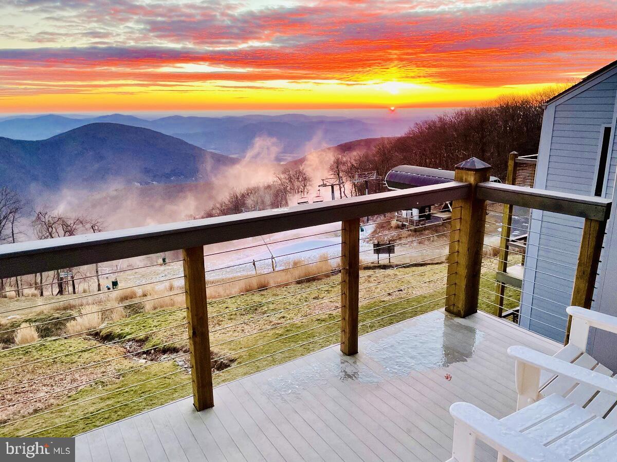 Experience the pinnacle of alpine elegance at 1421 Highlands, a top-floor sanctuary within Wintergreen Resort, VA. This 2-bedroom, 2-bathroom condo, fully furnished and turn-key ready, offers a lifestyle of luxury with stunning views of the Blue Ridge Mountains and direct ski slope access.
The expansive windows of the updated living room frame the ever-changing vistas of the slopes, providing a breathtaking, seasonally dynamic panorama. The master suite, a serene haven, includes dedicated workstations, perfect for remote work with a view. The second bedroom delights with a whimsical kids' area, designed for family fun.
Boasting exceptional ratings on Airbnb and VRBO, this condo is a proven success, offering the savvy investor a steady stream of income and guest satisfaction. As a top-floor unit, enjoy unmatched views and privacy.
1421 Highlands isn't just a residence, it's an investment in a lifestyle of mountain adventure, relaxation, and financial savvy, all wrapped up in the natural splendor of Virginia's peaks. Your extraordinary mountain experience awaits.