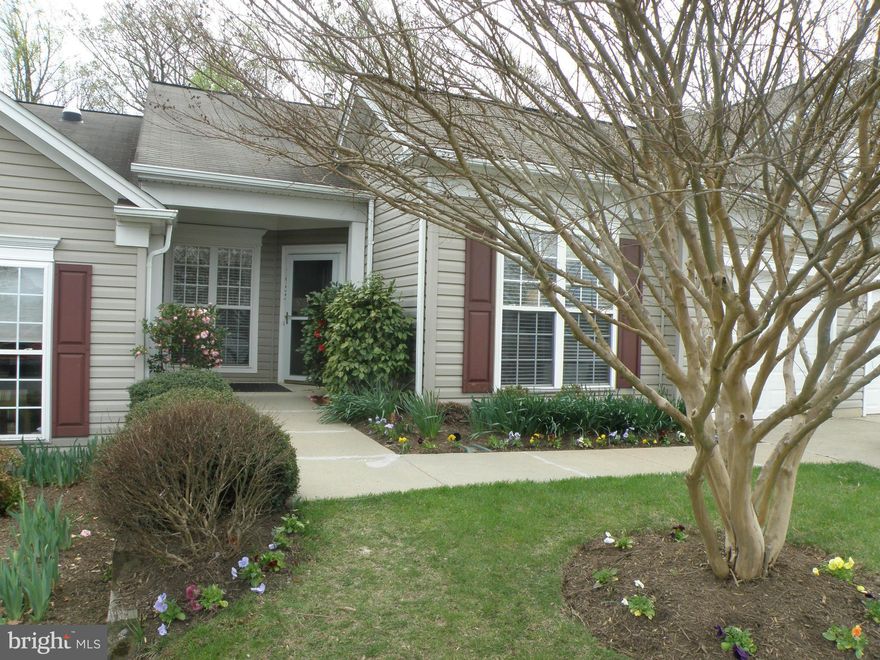 Immaculate one-level home, customized for wheelchair accessibility in desired active-adult community. Open floorplan with hardwood floors plus eat-in kitchen with granite counters. Sunroom and deck  back to trees. Move-in ready (wheelchair lifts can convey)