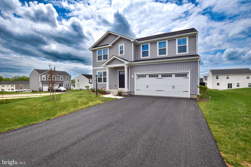 Prepare to experience style and comfort at every turn in this thoughtfully designed colonial style home. Located on a corner lot in highly sought after Cardinal Pointe is this 5-bed, 3-bath house that shows like a model. Enjoy the elegance and durability of LVP flooring as you step into this property. The main floor offers a flex space off of the entryway, perfect for a formal dining room, media room, or creative space. Beyond the entryway, the living room welcomes you with an electric fireplace and an open-concept design that flows seamlessly into a dining area and updated kitchen. This kitchen is perfect for entertaining. Equipped with stainless-steel appliances, sleek countertops, and custom shaker style cabinetry. The space also boasts a large center island perfect for meal prep or casual dining. The main level also offers a guest bedroom and full bathroom. The second level of this home features 3 additional guest rooms as well as a loft space offering additional opportunities to make this space your own. The guest bathroom on this level offers a double vanity and LVP flooring. The spacious primary suite features dual walk-in closets as well as an en-suite bathroom boasting LVP flooring, a double vanity, a walk-in shower, and a private water closet. If that isn't enough to want to call this place home it also includes a large unfinished basement. For those seeking a property that offers comfort and style with plenty of room to grow and personalize, this is home for you.