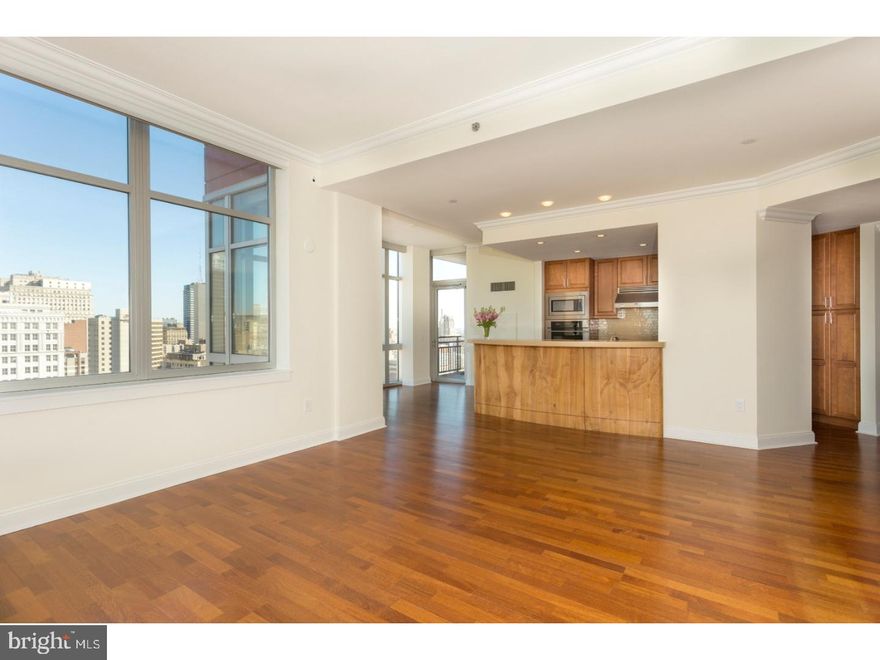 Be entranced by the glittering lights of the cityscape, listen to the classical music lingering in the air, soaring high from the Kimmel Center  ----  and take it all in.  Gorgeous and move-in ready, Suite 2501 at famed Symphony House boasts a comfortable 1,709 square feet and is by far the most highly coveted floor plan in the building.  This beautiful three bedroom, three bath residence is pristine and ready to welcome you home.  Lofty ten foot ceilings, beautiful hardwood floors throughout, and breathtaking 270 degree views.  The chic granite and stainless galley kitchen boasts a sleek glass-tiled back splash and provides the ideal open concept city living.  Gracious living and dining rooms are framed by oversized windows, and elegantly adorned with crown molding.  Step outside to your private balcony on the soaring 25th floor and breathe in the morning, or toast the night!   The master suite is a private haven with crown molding, recessed lights, and a spacious walk-in closet fitted with cherry built-ins.  An elegantly appointed marble master bath with custom lighting, dual sinks, a custom soak tub with separate shower, and linen closet complete the master suite.  The guest suite boasts an en-suite bath and a custom fitted walk-in.  The third bedroom is centrally situated within the residence, and affords the versatility of more expansive main living area, a comfortable den, or flex space for the perfect home office.  This highly sought after residence offers the ideal square footage to enjoy city living without compromising space.  Parking for two cars in the building's private garage and a storage locker are included with the residence. Offering unparalleled services and amenities, prestigious Symphony House is the city's premier Avenue of the Arts address boasting 24/7 concierge and doorman, 65' heated indoor lap pool, steam and sauna, state-of-the-art fitness center, bike share, beautiful outdoor terraces, Library, Clubroom, dining salons, wine cellar and Chef's catering facility. Stellar location, ideally situated amid the city's vibrant theatre district, steps from the finest restaurants, boutique shopping and all the city has to offer!