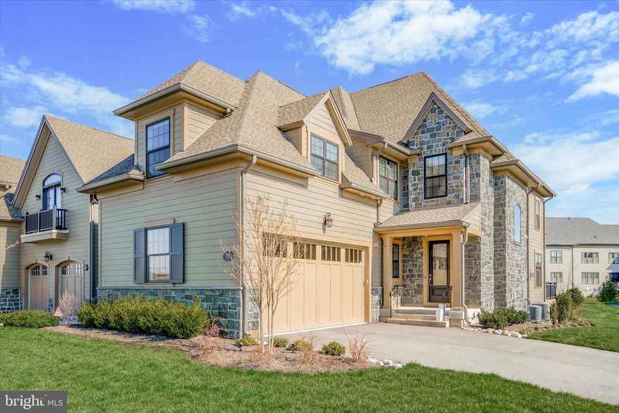 Stunning end unit carriage home in The Reserve at Creekside - the area's premier luxury community. This 3 Bedroom, 2 Full and 2 Half Bath Fairmount model offers over 4300 square feet of living space on three levels. The fabulous open floor plan features a large Living Room with tray ceiling, crown molding and gas fireplace, separate Dining Room with tray ceiling and crown molding,  gourmet Kitchen with expanded 12 foot island, tile backsplash, upgraded Bosch appliances and walk-in Pantry. A separate Mudroom, entered from the oversized two car Garage is unique in the community, with a large coat closet and storage. A Powder Room is conveniently located next to the Mudroom. Sliding doors from the Living Room open to an expanded Deck, which can also be accessed from the Breakfast Area.  Upgraded hardwood stairs lead to the second level which features an expansive Primary Suite with tray ceiling, crown molding and a large custom walk-in closet, opening to a spa-like Primary Bathroom with double vanity, oversized frameless shower and separate water closet. Two additional generously sized Bedrooms, one with wainscoting and crown molding  currently being used as an office, a large Hall Bathroom and Laundry Room complete the second floor. The Full, Finished Basement is an entertainer's dream.  A large living area, bar with beverage fridge and half bath offer endless possibilities. Additional features include upgraded hardwood floors on the main level, upgraded carpet, recessed lighting, upgraded light fixtures, covered sprinkler heads, 3M window covering on Living Room windows, Kitchen door and Stairway window, custom window treatments, Carrier Infinity Air Purifier, Culligan water system, Sonos sound system on the main level and basement and upgraded landscaping. Located between the two Philadelphia Cricket Club golf courses, the Reserve at Creekside offers the ideal lifestyle - maintenance free living with luxury amenities. A 4500 square foot Clubhouse includes a large Gathering Room with gas fireplace, Kitchen, Fitness Center and Outdoor Pool with covered flagstone Patio. Ideally located in Whitemarsh Township, within minutes of Fort Washington and Wissahickon Parks, the shops of Flourtown and Chestnut Hill and easy access to routes 309, 476 and the PA Turnpike. Schedule your tour today!