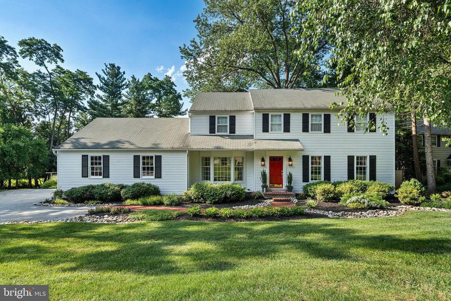 Tucked away on a picturesque cul-de-sac bordering eight acres of preserved land, this classic colonial exudes curb appeal and charm. A gently sloped driveway and beautifully landscaped walkway lead to the home’s entry, set back from the main road for optimal privacy. Inside, light-filled living spaces showcase custom millwork, oversized windows, neutral paint and a seamless flow that’s ideal for everyday living and easy entertaining. The formal dining room impresses with its beautiful bay window and intricate wainscoting, while the bright, spacious eat-in kitchen features sparkling white cabinetry, a custom tile backsplash and a breakfast area with scenic backyard views. Just off the kitchen, the cozy den with built-ins is ideal as a home office, while the expansive family room with gas fireplace offers a welcoming retreat. Other main floor highlights include a lovely front living room, powder room and a convenient laundry area with access to the attached two-car garage. Upstairs, the gracious primary suite boasts a dressing area with built-in vanity, ample closets and ensuite bath, while three spacious secondary bedrooms share a full hallway bath. The newly finished lower level adds valuable living space with its lounge area, sound-dampened office and plentiful storage. Outside, savor a sweeping, tree-lined backyard with access to eight acres of township-protected and maintained land, a circular stone firepit and a generous patio for entertaining under the stars. Located in top-ranked Tredyffrin-Easttown School District, homes in this friendly neighborhood enjoy easy access to downtown Wayne, King of Prussia, Gateway Shopping Center, Jenkins Arboretum and major commuter routes. Don’t miss your chance to own this exceptional home in one of the Main Line’s most coveted neighborhoods—schedule your private tour today!