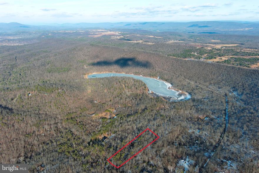 JUST BUY IT AND FIGURE OUT THE REST LATER.....5 ACRES OF PERFECTLY FLAT FOREST IN THE PRIVATE COMMUNITY OF "LAKE FERNDALE" WHERE OWNERS HAVE ACCESS TO THE 55 ACRE STOCKED LAKE & COMMUNITY BEACH AREA.  400 FT DRIVEWAY INSTALLED TO HUGE CLEARED BUILD/CAMP SITE IN THE MIDDLE OF THE PROPERTY FOR MAXIMUM PRIVACY, PULL IN YOUR CAMPER IMMEDIATELY! WHY PAY OUTRAGEOUS CAMPGROUND FEES WHEN YOU CAN OWN? WITH THE DRIVEWAY AND CLEARING ALREADY IN PLACE, YOU'RE AT LEAST 7-10K AHEAD OF THE GAME ON INFRASTRUCTURE COSTS. ONLY 1.5 MILES FROM THE LAKE ACCESS......FISH, SWIM, SUNBATHE, PICNIC, ETC.......4 MILES FROM 3 DIFFERENT PUBLIC ACCESS POINTS ON THE SOUTH BRANCH OF THE POTOMAC RIVER....FISH, CANOE, KAYAK OR HOP ON A TUBE WITH YOUR FAVORITE BEVERAGE AND LET YOUR WORRIES FLOAT AWAY.....5 MILES FROM "WHITE HORSE MOUNTAIN WILDLIFE MANAGENT AREA" 1765 ACRES OF PUBLIC HUNTING & HIKING AT YOUR DISPOSAL! PERFECT FOR YOUR FULL TIME HOME, WEEKEND ESCAPE OR BASE CAMP FOR OUTDOOR PURSUITS. IT'LL BE EASY TO "YES" TO THIS LOT....BUY IT NOW AND FIGURE OUT THE REST LATER.....STEP #1 TO LIVING THE DREAM, IS GETTING THE LAND........IF ONLY ALL OF LIFES DECISIONS COULD BE THIS EASY!