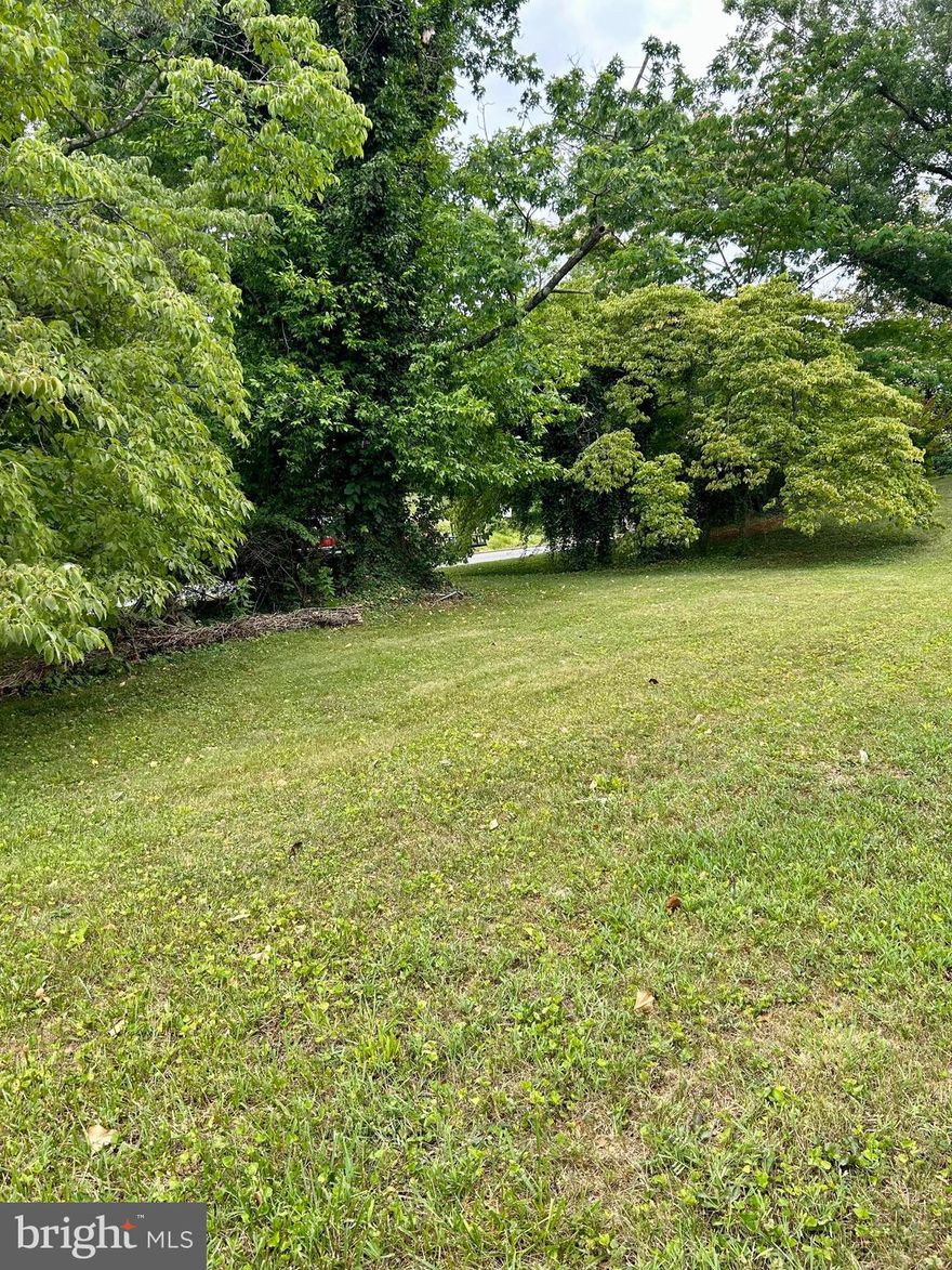 Corner lot opportunity in the desirable Greenfields neighborhood, ideally located at Main Street and Red Hill Road in the historic town of Orange. This .69-acre parcel offers a gently sloping topography—well-suited for a walk-out basement design—providing flexibility to maximize living space. The lot features an open, grassy setting bordered by mature trees on three sides, creating a natural sense of privacy while still enjoying an in-town location. Public water and sewer are available; current connection fees start at $15,330 and increase to $18,330 as of July 1, 2026. Bring your builder and design the home you’ve been envisioning—an excellent opportunity to build in one of Orange’s most sought-after neighborhoods.
