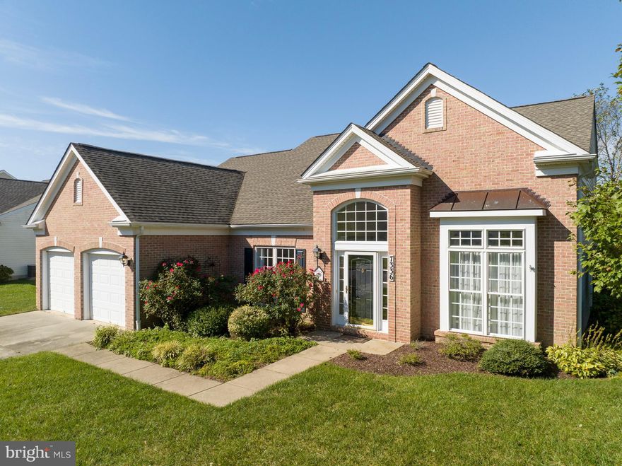 Vacation right at home in the desirable 55+ adult community of Easton Club East! If you are looking for the ideal location and community in which to spend your retirement days, then look no further. Fall in love with this charming brick-front single family home that offers 3 bedrooms and 2 1/2 Baths. This is  one of the few homes in the neighborhood that is on a corner lot, backs up to a private pond, and has a FRONT-entry 2-car garage (with epoxy flooring) and driveway. 

The main level has an open floor plan with TONS of natural light and  features like 9 " ceilings, NEW hardwood floors, a primary suite and ensuite bath with NEW CARPET and a tray ceiling, a separate dining with a tray ceiling and wainscoting, a living room with crown molding, a spacious laundry room, a gourmet kitchen with a large peninsula island and NEWER WHITE APPLIANCES, a large eating area, a family room with two-story ceiling and gas fireplace, and a beautiful sunroom. Take a few steps out of the sunroom onto a private brick patio that overlooks a quiet pond.
A feature that sets this home apart from many in the neighborhood is the BONUS second level!  The second level opens to a spacious loft area that could be used as home office, a game/media room or an additional sitting room.  Additionally, this level has two well appointed bedrooms plus a full bath - perfect for hosting holidays and out-of-town guests!

Enjoy all of the amenities that The Easton Club East has to offer: a clubhouse ballroom for dances and movies, the fitness center, billiards room, a library, a card room, and arts and craft room. Spend some time outdoors playing tennis/ pickleball, horseshoe, & putting green, or by taking a stroll on the walking paths that connect to multiple ponds.  Travel just a few easy miles to the quaint downtown Easton where you will find plenty of restaurants, boutiques, art galleries and more!! BWI Airport, our historic state capital of Annapolis, and the MD/DE beaches are easily accessible and so are some excellent medical facilities.