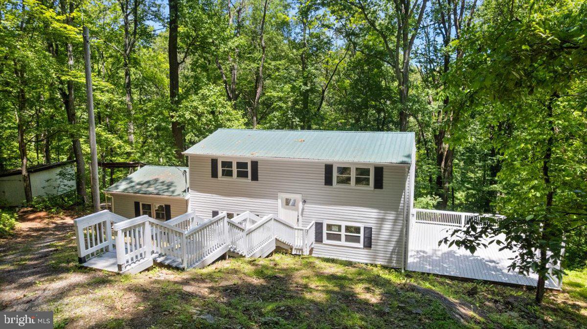 Fully Remodeled Home on 6.4 Wooded Acres with lake access in Highly Sought-After Fauquier County!
Escape to your own private oasis with this fully remodeled home, offering 1,728 sq. ft. of comfortable living space on 6.4 wooded acres. Move-in ready, this home features a spacious eat-in kitchen with tile floors, brand-new appliances, a new HVAC system, and a new hot water heater for worry-free living.
Step outside onto the expansive deck, perfect for entertaining or relaxing in the beauty of nature. A large bonus room offers endless possibilities—use it as a third bedroom, home office, or rec space. Additionally, a generous storage room doubles as an in-house workshop or creative space.
This unique property is adjacent to the renowned Linden Vineyards and within walking distance of the Appalachian Trail. Plus, enjoy exclusive access to a private neighborhood lake, perfect for fishing, kayaking, or simply unwinding by the water. Whether you're seeking a full-time residence, weekend retreat, or an Airbnb investment, this home offers incredible potential in a truly unbeatable location with lake access.
Don’t miss this one-of-a-kind opportunity! Schedule your private showing today.
