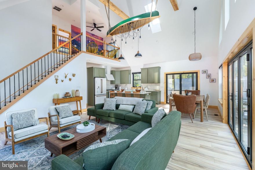 Step inside a Custom Modern Rustic Retreat where design, nature, and comfort collide. Built in 2025 and fully furnished with PUBLIC SEWER and NO HOA, this raised chalet was crafted to deliver an unforgettable experience, blending bold style with biophilic design that brings the US National Parks to your door step. Whether you are looking for your dream mountain to enjoy with family or friends or an investor looking to Airbnb (projected gross income of $200,000+) this home is a must see. From the moment you enter, you’ll notice the soaring ceilings, striking wall murals, and oversized black-on-black Andersen windows that flood the home with light and frame serene lake and forest views. The open-concept main level (2nd floor) is anchored by a tiled herringbone wood-burning fireplace, 2 skylights, and a gourmet kitchen featuring matte green cabinetry, white GE Café appliances, gas cooking, white quartz countertops, and designer gold hardware. Unique elements like the hanging canoe centerpiece and retro arcade machine make this home as playful as it is luxurious. With six spacious bedrooms, four full bathrooms, and a versatile gym/office, there’s room for everyone to spread out — whether it’s families, friend groups, or guests seeking a true escape.

Outside, the property’s outdoor oasis is built for connection and relaxation. Accordion-style doors open to a Trex deck with dining space, a fire pit, and a hot tub tucked below. A screened-in porch offers year-round enjoyment, while thoughtful amenities — like a dedicated bunk room, oversized Tic-Tac-Toe game, and loft for reading or gaming — ensure fun at every turn. Additional features include Aqua Guard Luxury Vinyl Plank flooring, a Tesla charging station with eight-car parking, 3-zoned HVAC, tankless hot water heater, brand-new well, and public sewer.

All this, just minutes from Big Boulder Ski Area, Hickory Run State Park, Split Rock Resort, Pocono Raceway, Jack Frost National Golf Club, and H2Ooooh! Indoor Waterpark. Dining hotspots like Nick’s Lake House, Louie’s Prime, and Shenanigan’s are around the corner, and with quick access to the PA Turnpike and Route 80, the adventure continues year-round. This home isn’t just a place to live — it’s a mountain-meets-modern retreat designed for making memories.