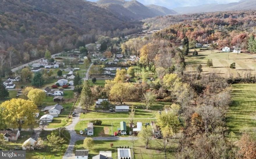 Check out this great investment opportunity. Just under half an acre with 5 mobile home lots available. Currently there are 4 lots rented, with 1 more open. No drive bys - Do not tour property without an agent accompanying and do not disturb any of the mobile home owners. Mobile homes are individually owned.