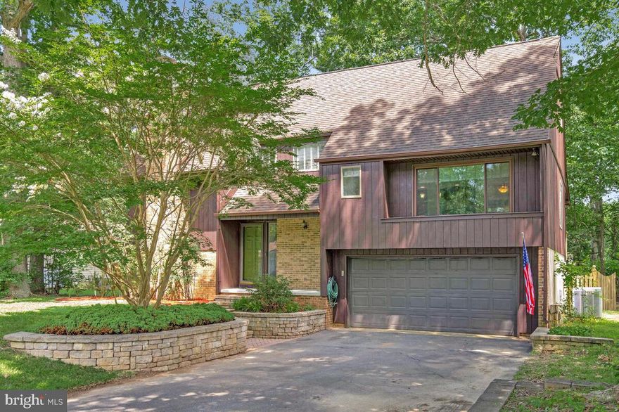 CEDAR COVE w/ BEACH access on the Chesapeake Bay! The sellers had this home pre-inspected and checked off the to-do list so you don't have to—it's move-in ready! So much about this home gives it character, and if cookie cutter isn't your style, you'll love this one! The kitchen is updated with custom 42" cabinets with crown moulding, granite counters and island, stainless steel appliances, and a flat surface cooktop. The living area features a stone accent wall with an electric fireplace and wall-mounted TV that conveys. An open loft above and high ceilings add to the open, airy feel.

Step outside to the screened-in back deck—a standout feature perfect for relaxing, dining, or entertaining in comfort. The fenced-in backyard offers privacy, a firepit, and direct access to the community walking trail just beyond the rear gate—great for outdoor enjoyment year-round. Inside, you’ll also find a brand new first-floor bathroom (2025), new flooring (LVP and carpet), fresh paint, new water heater, deck with new staircase, newer roof with gutter guards, and updated exterior T1/11 siding. Shed, 2-car garage, and more. A truly unique home cherished for nearly 25 years!