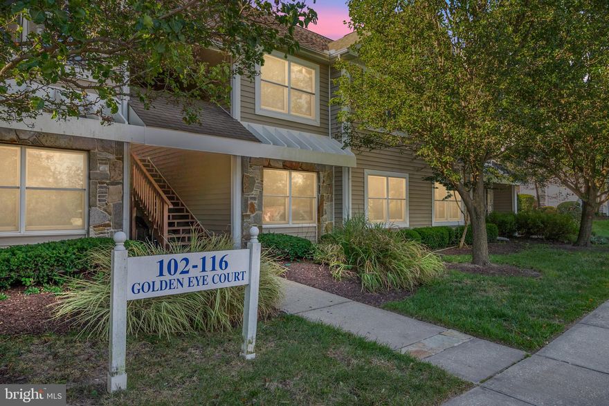 Welcome to 106 Goldeneye Ct in the desirable Bayside community.  This first floor unit is boasting 2 large bedrooms, 2 renovated bathrooms, LVP floors, and it backs to the pond! Gorgeous views!!! As you walk into the home you will notice the wide open floor plan, new LVP flooring throughout, and an upgraded kitchen.  The living room is large with a gas fireplace, large windows bringing in a ton of natural light, gorgeous views of the pond, and open to the kitchen and dining room.  The kitchen is boasting white cabinets, granite countertops, stainless steel appliances, and a breakfast bar.  The dining room is open to the kitchen and living room and offers great table space and the gorgeous views of the pond.  Down the hallway you have the laundry room, storage closet, and the hallway bathroom.  The hallway bathroom has been renovated with a new vanity and a shower/tub combo.  The second bedroom is large offering a ton of space and a nice size closet.  The owner's suite is perfect.  Large and open with a huge walk in closet.  The owner's suite bathroom is updated with a new vanity and flooring.  Outside you have a gorgeous balcony all overlooking the pond and beautiful landscaping.  Come enjoy the community pool, clubhouse, fitness room, party room, tennis courts and walking paths.  The community surrounds the marina so you can enjoy walking about the marina soaking in that Kent Island lifestyle. This is maintenance free living as all landscaping and exterior work is done for you! The convenient location to all shopping, restaurants, trails, marinas, parks, beaches and more, makes this unit the ONE!!! Don't pass this one by!