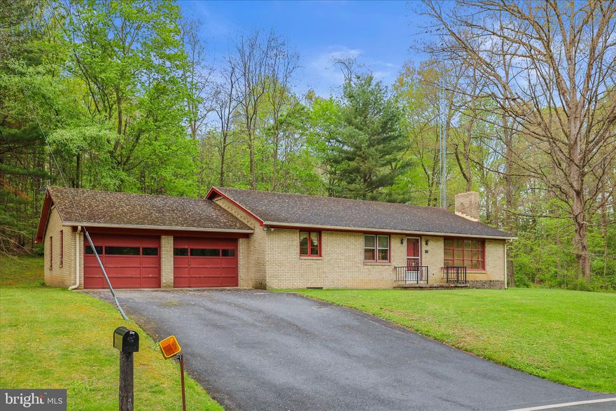 Welcome to this lovingly maintained family home, built with exceptional craftsmanship by a skilled brick mason whose attention to detail is evident throughout. From the moment you step inside, you’ll appreciate the quality construction, highlighted by two charming wood-burning fireplaces that add warmth and character.

This pristine home features three comfortable bedrooms and one full bathroom, along with an additional shower in the basement for added convenience. A full-length walk-up attic provides abundant storage space and adds to the home’s overall functionality. The oversized two-car garage offers plenty of room for vehicles, storage, or a workshop.

Situated in scenic Carroll County, Maryland—just under 300 yards from the MD/PA line—this property offers the perfect blend of peaceful country living with easy access to nearby amenities.

The main level boasts an unusually spacious kitchen for a home of its era, a feature that today’s buyers will truly value. The well-crafted cabinetry remains in excellent condition, offering both functionality and timeless appeal. The seller has chosen not to replace the non-working oven, giving the next owner the opportunity to update and customize the space to their taste.

Downstairs, the basement presents a blank canvas ready for your vision. With the brick base already in place for a future bar and a second fireplace, it’s an ideal opportunity to create a cozy entertainment area or additional living space.

Recent updates include a propane forced-air heating system, central air conditioning, and a new water heater—all installed in 2025—providing modern comfort and efficiency.

Being sold as-is by the daughter of the original owners, this home is a rare find—solidly built, well cared for, and full of potential.

If you’ve been searching for a quality home in a serene country setting, don’t miss this opportunity. Schedule your showing today!