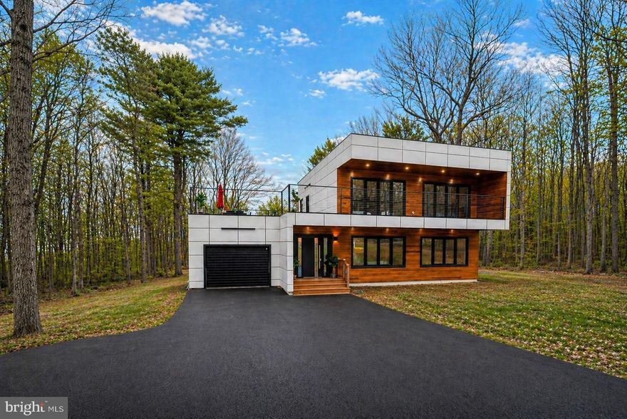 Experience the true meaning of a modern home in this beautifully upgraded New Construction, offering a second model of the stunning new construction behind this property, but with even more enhancements—and set on a quieter street for added privacy. Designed to impress, this home features large, multi-functional windows and doors that flood the space with natural light while creating a seamless connection between indoor and outdoor living. A standout feature is the expansive second-floor oversized deck, accessible from the hallway and two bedrooms—perfect for morning coffee or evening relaxation. Inside, sleek contemporary finishes define the space. LED spotlights illuminate the home throughout, while a striking open staircase with glass railings adds a bold architectural touch. The kitchen is a true centerpiece, showcasing frameless cabinetry with under-cabinet lighting, stainless steel appliances, and a clean, modern aesthetic ideal for entertaining or everyday living. The exterior is equally impressive, featuring durable Hardie backer siding complemented by warm cedar wood accents for a sophisticated, natural look. Located just minutes from outdoor adventure and local attractions, you’ll enjoy easy access to Lehigh Gorge State Park, 100 Mile View, and the charm of Jim Thorpe, known for its shopping, dining, and year-round events. A public pool is also conveniently located about a mile away. Additional highlights include a builder’s one-year home warranty, offering peace of mind with your new investment. Property taxes have not been assessed yet. Please reach out to the township for an estimate.