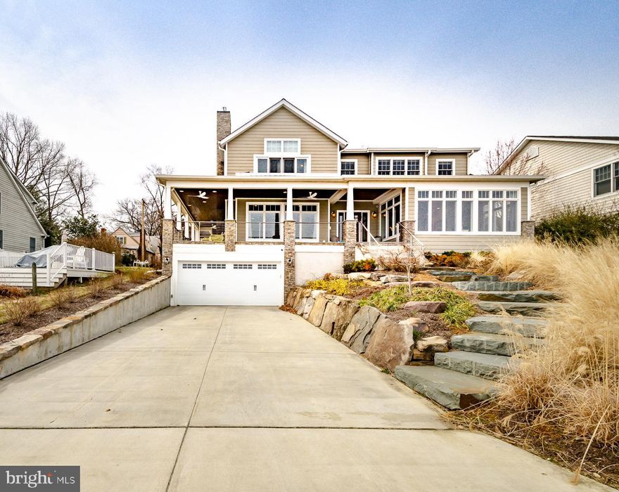 With unobstructed views of the Chesapeake Bay as your front yard, this quintessential Annapolis home offers unmatched warmth and quality in the one of the most desirable waterfront communities in Annapolis. Over 5,000 finished sq ft of custom-built living space includes 6 bedrooms (including owner suites on the main and upper levels), 4 full bathrooms (steam shower in the upper master), and 3 half bathrooms (one on each level). Main level offers a chef's kitchen complete with Wolf Range, SubZero refrigerator, 2 dishwashers, a built-in coffee/espresso station, dual sinks including pot-fill faucet, and more. The open concept allows for spectacular Chesapeake Bay views throughout the main level, the Bay Bridge is quite literally your backdrop. 4 bedrooms upstairs (one used as office w/it's own half bath), and a finished basement that includes a huge great/family room, half bathroom, and a guest room w/full bathroom. A custom 9 zone hvac system keeps all levels at the perfect temperature, at a fraction of the cost of standard systems. From the moment you step in the inside entrance to the basement from the garage (into one of two flagstone-floored mud rooms), the floor plan flows beautifully. The whole-house (including garage) Bose sound system (app-controlled) welcomes you home as you ascend to the main level and look across the open Bay. Spectacular. The community amenities including a pool, beaches, clubhouse, marina, and much more. This home is truly a must-see, and an opportunity that seldom comes along!