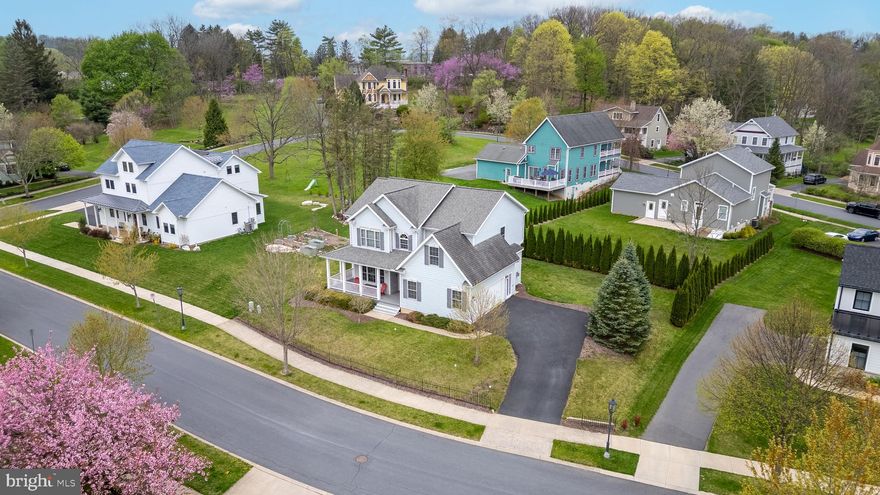 Nestled within walking distance of historic Lemont Village and less than 2 miles from Penn State University and downtown State College, this stunning home is the perfect combination of peaceful living and easy access to all the excitement Happy Valley has to offer.  The spacious and beautifully maintained home features 4 bedrooms and 2.5 baths designed to offer the perfect blend of elegance, comfort, and modern living. Upon entry, you are immediately greeted with rich hardwood floors that flow throughout the main level providing an element of warmth and character.  The open concept living area with gas fireplace and abundant natural light flows effortlessly into the elegant eat-in kitchen.  Sleek stainless steel appliances, large island, and generous counter space provide the perfect area for meal prep and set the stage for relaxing evenings and welcoming get-togethers. Rounding out the main level is a charming half-bathroom and a cozy, sun drenched sitting room framed with French doors- an inviting space easily transformed to match your creative vision. Upstairs you'll find a thoughtfully designed layout with wide walkways and spacious bedrooms that provide flexibility for guests, a home office, or playroom space. The large owner's suite is a true sanctuary that features a beautifully incorporated tray ceiling, walk-in closet, and private en suite bathroom with dual vanities, step in shower, whirlpool tub, and additional walk-in closet space! With even more space in the full unfinished basement, the possibilities are endless—whether you're looking to create a gym, home theatre, or additional living space, it's the perfect blank canvas.  Step outside onto your covered front porch, perfect for sipping morning coffee or greeting neighbors. In the evening enjoy the private tree-lined backyard with low-maintenance composite deck, ideal for summer barbecues, outdoor dining, or quiet seclusion. This move-in ready home is a true gem in a fantastic location—elegant, lovingly cared for, and ready for you to make it your own. Don’t miss the opportunity to experience modern living in a charming community close to schools, shops, walking trails and everything you love about State College! Schedule your private tour today!