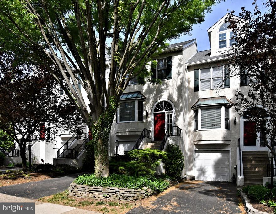 Welcome to 3051 Mitchell Court, a thoughtfully upgraded and meticulously maintained townhome nestled in a highly desirable cul-de-sac in the prestigious Lafayette Hill section of Whitemarsh Township. This 2-bedroom, 2.5-bath residence offers approximately 1,748 square feet of living space, a one-car garage, and an impressive list of custom features that truly set it apart.

Step inside to discover an inviting layout with beautiful red oak hardwood flooring throughout the main and upper levels. The chef-inspired kitchen features elegant Level 6 Cinderella Blue granite countertops, a deep, double Artisan stainless steel sink, and touch-controlled under-cabinet lighting for both functionality and ambiance. Whether you're preparing meals for entertaining guests, this space is both stylish and practical.

Upstairs, you'll find two oversized bedrooms and updated bathrooms with undermount sinks, granite vanities, and upgraded Danze fixtures, providing a touch of luxury and comfort. The living room features a fireplace already plumbed and ready for a gas insert or log set, adding warmth and charm to the main living area.

The ground level is finished with durable, insulated luxury vinyl tile flooring over a concrete slab, making it comfortable and ideal for a family room, office, or workout space. This level also offers direct walk-out access via a French door to an incredible custom rear patio made from Pennsylvania Blue Sandstone, surrounded by raised planting beds and natural views, perfect for outdoor entertaining, gardening, or simply relaxing.

One of the most unique features of this home is the spiral staircase connecting the rear patio to the upper deck, allowing for seamless indoor-outdoor living and a layout not commonly found in this community. Additional outdoor amenities include a serene setting at the back of the property, distant from road traffic and backing to natural surroundings, offering a sense of privacy and tranquility.

The home also features numerous mechanical upgrades, including a high-efficiency Amana 16 SEER 2.5-ton heat pump with 95% gas backup and upgraded venting, a newer gas water heater, washer and dryer, and an alarm system that can be reactivated for added peace of mind. For added energy efficiency, the attic has been upgraded with insulation and includes a temperature-controlled exhaust fan that can be used seasonally for whole-house ventilation.

Located just minutes from local shopping, restaurants, top-rated Colonial School District schools, and major commuter routes, this home offers an exceptional lifestyle in one of Montgomery County’s most sought-after neighborhoods. Whether you're looking for space, comfort, or standout upgrades, 3051 Mitchell Court delivers it all!  Don’t miss this rare opportunity!