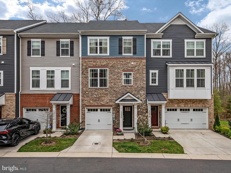 Offer deadline of 3/25/24 at 6pm.  Seller will review offers Tuesday. Open House Sunday, Match 24, 2024 from 12-3pm. Welcome to this unique opportunity & meticulously maintained luxury townhome in the sought-after Riverwalk Community of Crofton!  Built in 2021, this home gives you all of the amenities and upgrades of a brand new home without the wait!. As you walk into the home you will notice the pristine landscaping, garage, and inviting front entry.  This home features 5 spacious bedrooms and 3 ensuite baths! When you take the custom hardwood steps up to the next level you will walk into a completely open floor plan and into the gorgeous custom kitchen, living room and dining room. The kitchen features upgrades galore including stainless steel appliances, granite countertops, custom backsplash, double, 42" cabinets, gas cooking, and center island. The living room is super spacious and the dining room will fit a large dining table perfect for entertaining. This level also boasts upscale hardwood floors and a half bath. On the third level you will find 3 bedrooms, two full bathrooms, and the laundry area. Enjoy peace in the large primary bedroom overlooking the rear trees. This primary space is complete with large walk in closet and attached primary bathroom including ceramic tiled floors/shower, and double vanity with quartz countertops. The hallway will lead you to your second full bathroom with tub/shower combo, the laundry area and two additional large bedrooms with ample closet space. Being in the community of Riverwalk at Crofton means being close to Annapolis, D.C., Baltimore, and amazing dining and shopping options. Very close to major commuter routes, parks, and night life. THE SELLER DOES CURRENTLY HAS A 2.25% ASSUMABLE VA LOAN.  What an incredible opportunity to own a beautiful, luxury home at a tremendous value! There is also a builder home warranty on any water intrusion through Beazer Homes that is transferable to the new home owner. Homeowner is also offering a CINCH HOME WARRANTY FOR THE NEW HOME OWNER. Please reach out to listing agent for details.