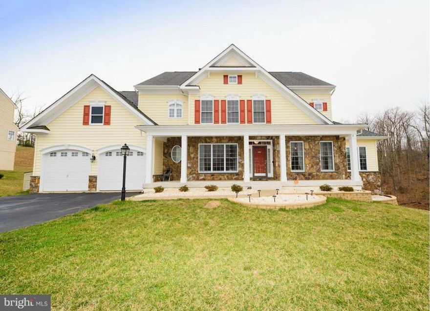 Beautiful and Open 6 bedrms 4.5 baths. Liv and din rms, two story family rm, side sunrm, study, and breakfast room. Gourmet kit w/ granite, ss appliances, double ovens, island.  Hardwood in foyer, stairs, powder rm, kit and breakfast rm.  Master w/ spa like bath.  Basement has rec rm w/custom bar, theatre rm, 2 bedrms, full bath, wine closet. Built in sound system throughout.  Mins to Quantico.