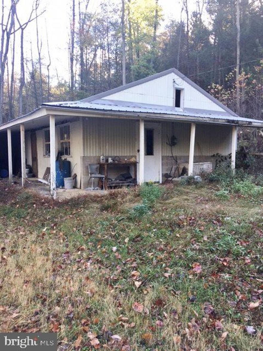 Don't miss your chance at nearly 12 acres with a cabin in Greenwood Township, Juniata County. The property is sloped with mature pines, which provides excellent coverage for animals and makes this parcel ideal for hunting. Cabin sits at the bottom of the land in a clearing, access is by way of gate at the top. The cabin has electric but needs TLC. There is an outhouse with a holding tank below grade, however there is no water or sewer ran to the existing cabin. The property is being sold in As-Is condition.