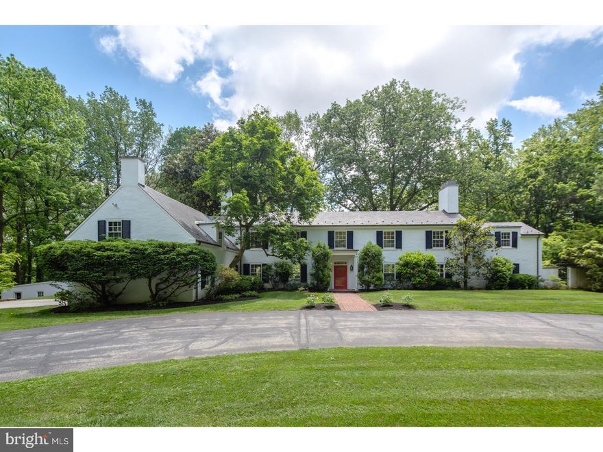 Don't miss your opportunity to own this significant home by renowned architect Walter Durham at the end of a private road in walk to Wayne Radnor Township. This house was originally built in 1927 for the Pew family as their country estate. Enter through the private drive and find this magnificent Colonial home that has been meticulously restored by Coppock Properties using Rene Hoffman designs; features include large room sizes and beautifully restored oak floors. This 5 bedroom, 4 full and one half bath home is set on a private 2.94 acre lot with mature trees, specimen plantings, Koi pond, swimming pool and 4 brick patios. Enter through the front door and to the right, find the large formal living room with fireplace. Connected to that is the quiet office with extra large fireplace, built-ins and exposed brick flooring. To the left of the front door and through a wide opening is the formal Dining Room which has handsome millwork and easy access to the newly renovated chef's gourmet eat-in kitchen with granite countertops and a Thermadore appliance package, including a wine cooler in the butlers pantry, custom cabinetry and custom wood ceiling treatments. Right off of the kitchen is the spacious and bright family room, perfect for family living. A half bath and a mudroom off of the garage with custom closet and cubbies complete this floor. Ascend one of the 2 stairways leading to the second floor and find the luxurious Master Suite with fireplace, his and her walk-in closets with custom built-ins and tastefully renovated Master Bath with cast iron soaking tub, beautiful calcatta marble, heated radiant floor and additional closet. An au pair suite, three additional spacious bedrooms and a laundry room complete this floor. As a special bonus, there is also an on-suite second story deck and a balcony that goes across the entire back side of the second story. The homes three finished levels, including a finished Lower Level, provides ample space for family living and entertaining. There is an attached 2 car garage as well as an additional detached 2 car garage. This home features a newer Slate roof and updated plumbing and electric. It also has a state of the art hydronic heating system and central air. Move right in and enjoy this fantastic blend of old and new construction within walking distance to trains, renowned schools, shopping, restaurants and more.