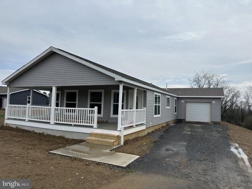 This stunning 3 bed, 2 bath home with a full covered porch and attached 1 car garage sits on a very large private lot.  As you enter the bright gathering room with cathedral ceilings and electric fireplace you will find a wall of windows that open to the front covered porch.  The attached kitchen is well appointed with many upgraded features such as a stainless steel farmhouse sink, gourmet gas stove, spice cabinet, recessed lighting and so much more.  The back bedroom opens to a private patio that overlooks a large grassy area to accommodate all your entertaining needs.  The oversized one car garage offers plenty of space for storage and additional parking outside.  Call today to schedule an appointment!