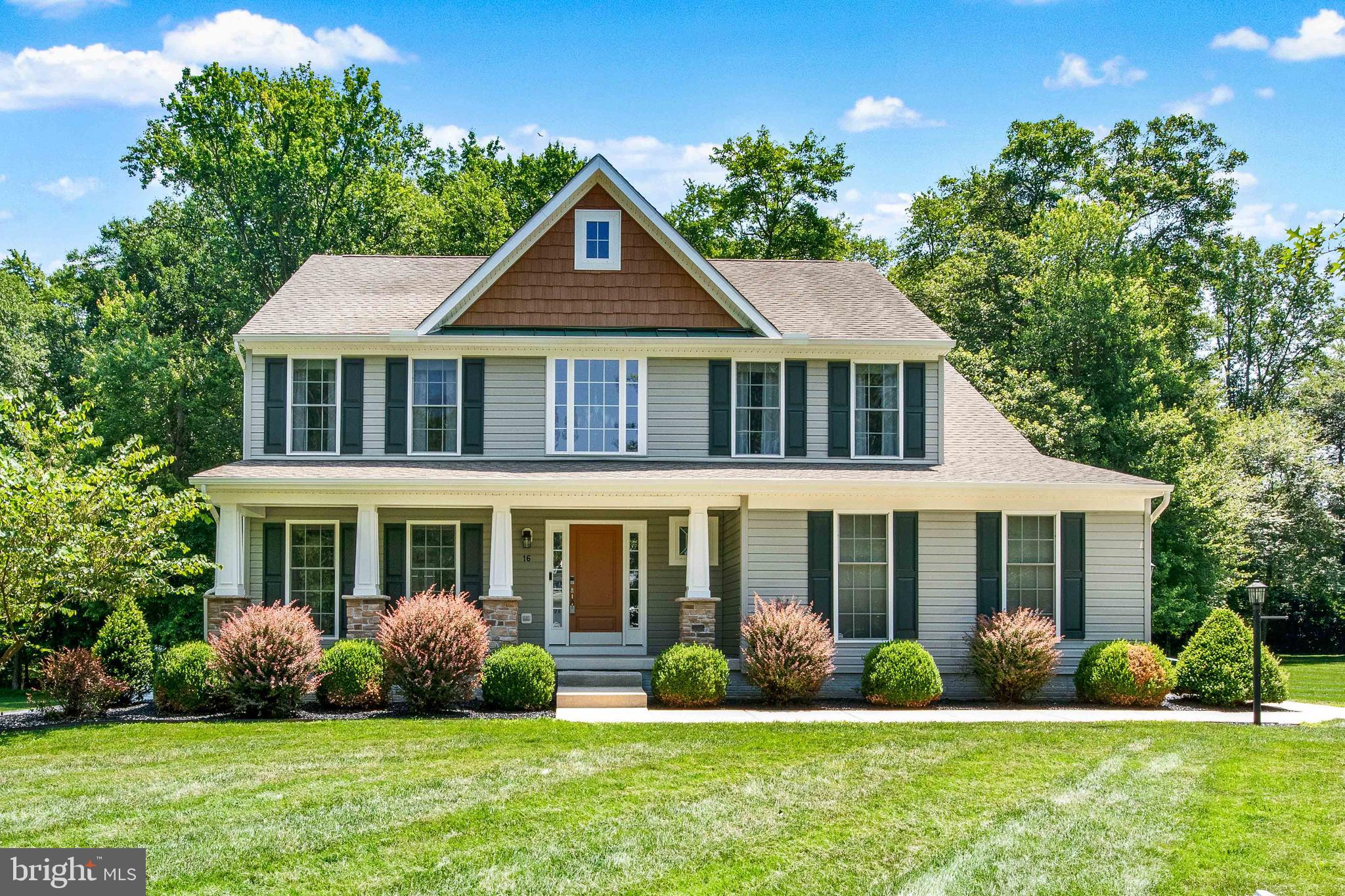 Pride in ownership is evident throughout 16 Candice Drive, Port Deposit, MD. Located on a small, quiet cul-de-sac street, this move-in ready home boasts 4 bedrooms and 3.5 bathrooms. Entering the home from the covered front porch you'll notice a bright two-story foyer and a half bath. The living room off of the foyer could also be used as an office. The open concept main level is bursting with natural light. Spacious family room offers the warmth and convenience of a gas fireplace. Enjoy meals in the eat-in kitchen with granite counter tops or adjacent dining room. The newly added two-tier rear deck is large enough to entertain or simply sit and overlook the wooded landscape. Laundry room is currently on the lower level; however, additional hookups are located off of the 2-car garage entry. Two laundry room locations to choose from. Upstairs, you'll find 4 bedrooms. The large primary includes a custom wall feature, vaulted ceiling, two walk-in closets, and custom wall paper in the en-suite bath. Three additional bedrooms and full bath rounds out the upper level. Lower level has an additional family room, full bath, playroom, craft room/workshop, and entrance to the rear yard through a large sliding door. Lots of extra storage space in unfinished section of the basement or use the storage shed in rear yard. Outside is the ideal rural setting to enjoy nature, plant a garden, or play. Conveniently located between I95 and Rt 1 for easy commute to work or shopping. You'll feel right at home at 16 Candice Drive in Port Deposit.