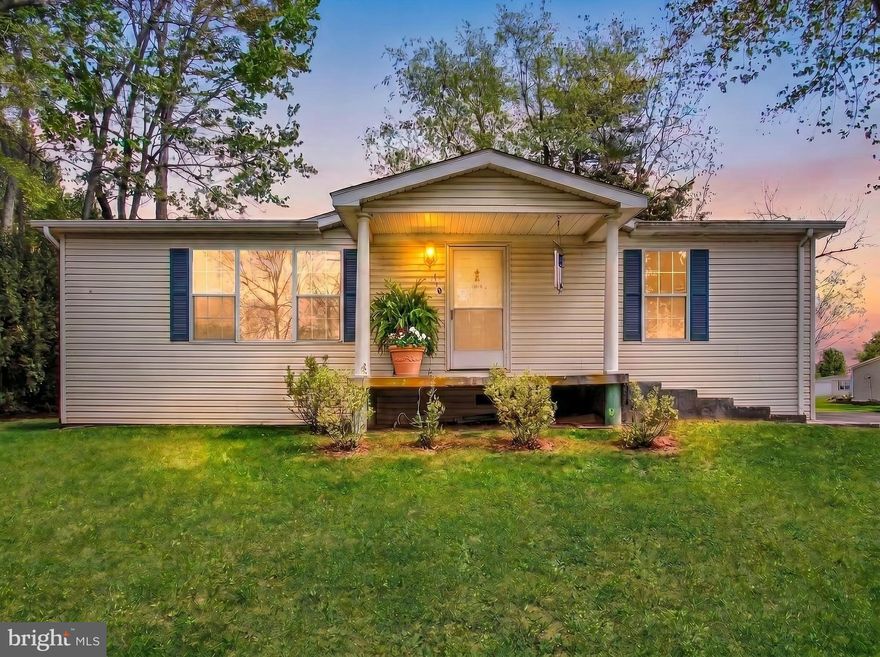 A terrific find in a desirable, Well-kept 55+ Community!   Enjoy the comfort, simplicity, and ease of low maintenance living in one of the community's  rancher style homes.  Nestled on a peaceful lot surrounded by mature trees, this charming ranch-style home offers bright, inviting living spaces and thoughtful updates throughout. Step inside to an open-concept living and dining area filled with natural light, soft neutral palettes, and comfortable modern furnishings. The spacious kitchen features extensive cabinetry, a skylight that brightens the entire room, and plenty of counter space for cooking and gathering.
Both bedrooms are generously sized, each with multiple windows, warm carpeting, and serene views. The bathrooms offer great storage, large vanities, and classic details, including a skylight in one for added natural light. A dedicated laundry area adds everyday convenience. Outside, the home truly shines with a covered front porch and a rear deck, perfect for morning coffee, outdoor dining, or quiet evenings by the fire pit. Surrounded by greenery and open yard space, the backyard feels private and peaceful—ideal for relaxing or entertaining.   This home is full of warm character blends comfort, style, and easy single‑level living in a setting that feels like a retreat.  There are some minor repairs that are needed.   The roof is just 5 years old and the home has a newer hot water heater!  All appliances convey!   Schedule a tour today, so you don't miss out on owning this home!