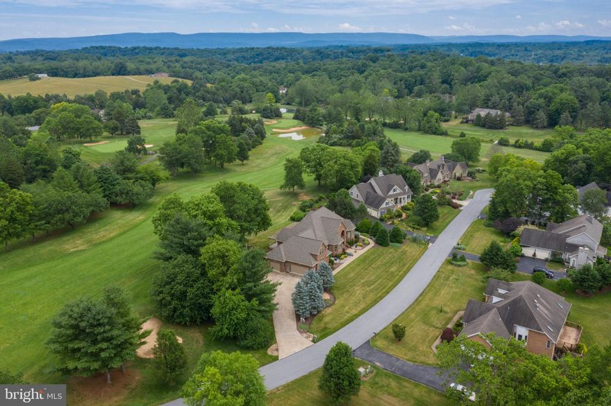 Take a look at this custom built  home sited on the Cress Creek Golf Course in Historic Shepherdstown WV. This handsome home offers so many options with a delightful floor plan sure to please. Walk into an inviting foyer with an open view of the outside and a living area full of surprises.  Everywhere you look there is a well appointed vision. From the open and inviting living room with fireplace highlight to the beautiful kitchen with maple cabinetry, corian counter, built in pantry and awesome tin ceiling feature.  A wonderful den filled with built ins can be easily transformed into a 4th bedroom or work from home office with pocket doors to close off for complete privacy. The front bedroom cozies up with bay windows and large closet attached to a private bath.  The gorgeous sunroom with a turret style design offers panoramic views of the golf course and pond and opens to the rear full featured deck with overhead pergola. The dining room is beautifully wallpapered with custom window treatments on the bay windows looking out at the front yard and landscaped view.  Enter into the master retreat (in this split bedroom floor design) and feel at home immediately.  The attached master bath is a haven.  What a surprise when you continue down the hallway to the large laundry room and staircase to upper level housing the 3rd bedroom, private bath, attic storage and large closet storage.  And don't forget the large end load 3 car garage with more storage and access to an enclosed rear pet area or integral garden spot. The vision is yours. Love to spend time outdoors. The hummingbirds, songbirds and wildlife are plentiful and the current owner has lovingly prepared the landscape for full enjoyment ever changing with the seasons, outside lighting and sidewalk to meander your property all day and evening.  The transformation from day to night is another reason to love this place! Cart paths throughout the course make it easily accessible to the Clubhouse and amenities! And the Historic town of Shepherdstown offers fine dining, Shepherd University and it's wonderful Wellness Center (Silver Sneakers accepted), the C&O canal along the banks of the Potomac River and so much more!  Make this one your new home and enjoy all this community and it's surrounding historic town offer! Very energy efficient!
