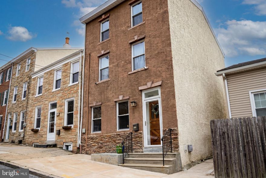 This is the one! 204 Dawson Street is a spacious 4-bedroom, 2 full bath home located in the coolest neighborhood - Wissahickon. Natural light flows through the home, highlighting high ceilings and unique hardwood floors. Deep windowsills and a tall archway between the living and dining rooms add a touch of historic character. The dining room - large enough to accommodate a pool table - features an adorable built-in and access to the basement. 
The eat-in kitchen is a dream, featuring granite countertops, marble backsplash, ceramic tile flooring, and stainless steel appliances. You may actually enjoy doing the dishes while looking out onto your private backyard! Designed for relaxation, the outdoor space features a fenced-in, low-maintenance turf yard with plenty of room for gardening.
The primary bedroom has a transom window and 2 walk-in closets, while the stylish primary bath features granite counters and double sinks. Across the hall, you’ll find another spacious bedroom with a walk-in closet and clever cubby storage. Don't miss the charming extra storage nook in the hallway!
The third floor is incredibly versatile - a guest suite, workout room, or home office as it's currently used. This level includes its own stylish full bathroom, giving your visitors total privacy.
Laundry is located in the clean and spacious basement, which also has a sealed walk out bilco-type door. There is enough space to add a powder room in the dining room or the basement.
Just minutes from the Wissahickon Train Station, Pretzel Park, and the vibrant dining and shopping along both Main Street and Ridge Avenue. Including a Best of Philly Winner White Yak. This home offers the ultimate Philly lifestyle! 1 year American Home Shield Warranty included!
*Open House Sunday from 12 to 2pm*