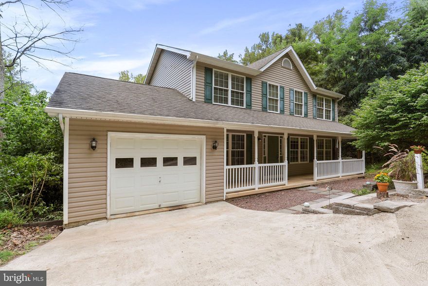 Well-maintained colonial in the woods of the Shannondale community! Featuring 4 bedrooms, 2.5 baths. LVP flooring throughout. Main level offers a separate living room and sitting room. Eat-in kitchen with granite countertops, island, and dining room area. Family room with wood-burning fireplace. Bedrooms on upper level. Primary bedroom with walk-in closet and en suite with jetted tub, separate shower and double sinks. Unfinished basement with radon system, walkout level to backyard. 1- car garage. New water heater. No HOA. Property backs to the Shannondale Springs Wildlife preservation. Close to the Shenandoah River and Mountain Lake Club. Schedule your showing today!