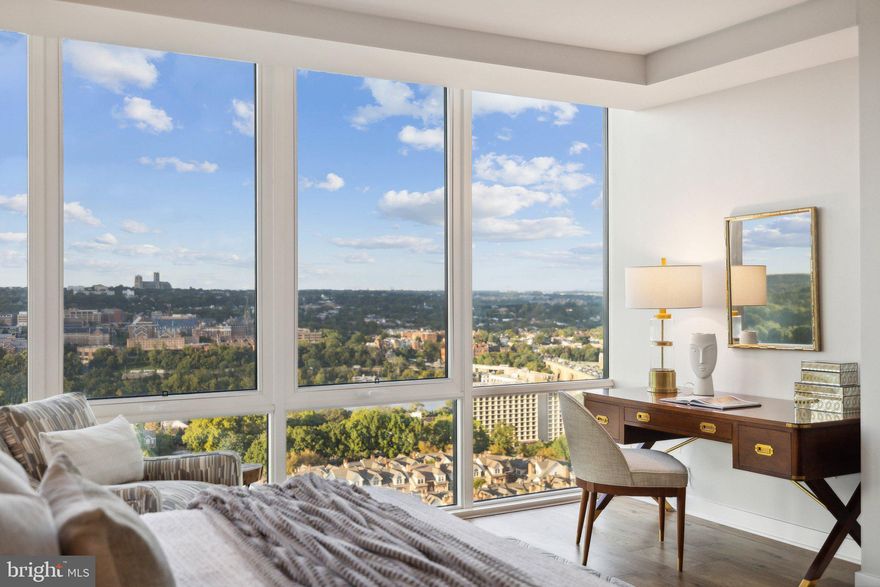 Welcome to the pinnacle of luxury living at The Pierce, where this exceptional residence stands as the premier offering in the building. Perched on 20th floor, this exclusive unit provides direct, sweeping views of the Potomac River, the DC skyline, and Washington’s iconic monuments.

The sophisticated layout of this 2,382-square-foot residence delivers an unrivaled blend of grandeur and comfort. Expansive floor-to-ceiling windows frame panoramic city and river vistas, while a private 22’ balcony extends the living space outdoors. Imagine sipping wine as you take in the sun glistening off the Washington Monument or hosting intimate gatherings as the sun sets with the city as your backdrop.

Every inch of this home is designed to the highest standards. The chef-inspired kitchen is equipped with Thermador appliances and Snaidero cabinetry, accented by sleek quartz countertops and an oversized island perfect for both meal preparation and socializing. Entertain in style with a built-in wine refrigerator & generous entertainment spaces illuminated by gallery-quality lighting. Hand-scraped hickory floors run throughout, lending warmth and elegance to every room, while the walk-in pantry, finished in matching Snaidero cabinetry, provides ample storage for all your culinary essentials.

The private quarters of this residence are equally extraordinary. Spacious bedrooms serve as tranquil retreats, each offering river and skyline views. The owner’s suite is a masterpiece of luxury, featuring an exquisite marble bathroom with heated floors for ultimate comfort. The generous walk-in and second closet are beautifully outfitted and easily customizable to suit your needs. Every detail, from the premium fixtures to the carefully selected finishes, creates an atmosphere of understated opulence. A secondary bedroom offers a private full bath and two large closets. The separate laundry room features a full-size washer and dryer with a wash sink, while a separate powder room is available for guests. If you work from home or desire a place to retreat, the generous den is a quiet haven also offering broad views of the skyline and the river.

With two garage parking spaces conveniently located near the elevator and on-site indoor bike storage, your day-to-day living is as seamless as it is sophisticated. The convenience continues with a dedicated storage unit located directly on your floor, further elevating the ease and function of this residence.

Living at Pierce means enjoying access to a host of exclusive amenities that enhance both convenience and lifestyle. The 24-hour concierge service is at your disposal, offering white-glove assistance for all your needs, ensuring every day feels like a luxurious retreat. The luxe club room, 65-foot resort-style pool, and two-story fitness center provide the perfect venues for relaxation and recreation. The rooftop entertainment terrace, complete with lounge areas, cooking spaces, and scenic views, offers an outdoor sanctuary amidst the urban environment.

Stepping out from Pierce’s luxurious, hotel-style lobby, you’re just minutes from the Rosslyn Metro, making it simple to access the best of Washington, DC. Whether you're heading to Georgetown for a world-class dinner, catching a lecture downtown, or attending a performance at the Kennedy Center, the finest of DC culture is at your fingertips. For daily conveniences, Safeway is located just next door, and the neighborhood offers an exciting mix of dining and wellness options. Outdoor enthusiasts will love the nearby Freedom Park, Gateway Park, and adjacent Rosslyn Highlands Park.

This home represents a singular opportunity to experience a life of luxury, comfort, and convenience, all in a location that offers the very best of urban sophistication. Experience Arlington’s Most Elevated Address—a residence that is truly one-of-one.