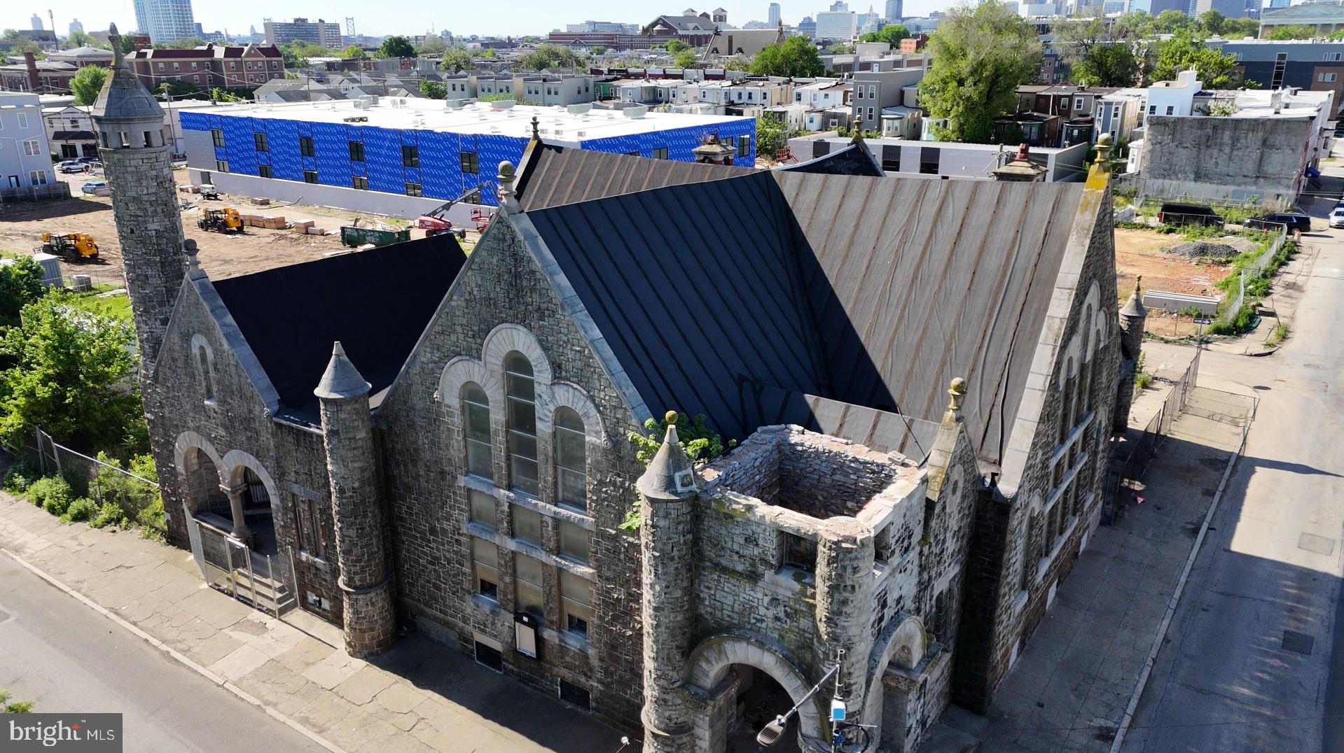 A historic landmark situated in a rapidly developing neighborhood, just blocks from Temple University. Positioned at the intersection of Cecil B. Moore Ave and Ridge Ave, 2036 Cecil B. Moore offers a 14,000 sq ft lot with additional undeveloped land ideal for parking or future expansion. This former church features stunning stone architecture, grand archways, and intricate stained glass—presenting unique potential for conversion. Zoned RM-1, the rectangular corner parcel is being sold as-is. It’s surrounded by new developments and sits next to a renovated YMCA and park. Just 3 minutes from Temple University with excellent public transportation access—only half a mile from Broad Street and the Broad Street Line, and less than a mile to Center City. Frontage spans approximately 100 ft on Cecil B. Moore Ave and 140 ft on N 21st St.