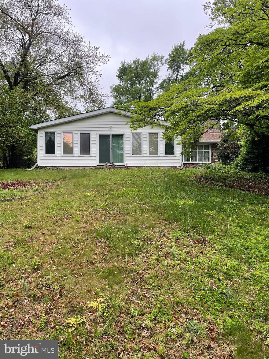 MULTIPLE OFFERS RECEIVED.  PLEASE HAVE HIGHEST AND BEST OFFERS IN BY FRIDAY 5/23 AT 9 AM!  No escalation clauses. Investors looking for their next project...look no further!  This home has good bones but needs to be cleaned out and completely rehabbed.  It's a very interesting layout!  The one side of the home has 3 bedrooms and 2 full bathrooms.  There is a spacious sunroom on the front of the house.  You'll also find a large living room, dining room, and kitchen.    Beyond the kitchen leads you out to the back of the home to a patio and partially fenced in yard.  Coming back into the home, through which used to be a breezeway, you enter the in-law suite featuring a living room/bedroom, full bathroom and kitchen.  You can access the partially finished basement with a bar, office/bedroom, and another full bathroom from either side of the home.  Continuing through the basement you will find a garage with plenty of storage and the washer/dryer hookup.  You can access the backyard through the bilco doors or head back upstairs to the main kitchen.  This home could be transitioned back to a traditional layout or leave it as it is.  Buyer is responsible for anything pertaining to the U & O permit.  Buyer is responsible for cleaning out the home.  It's being sold as-is.