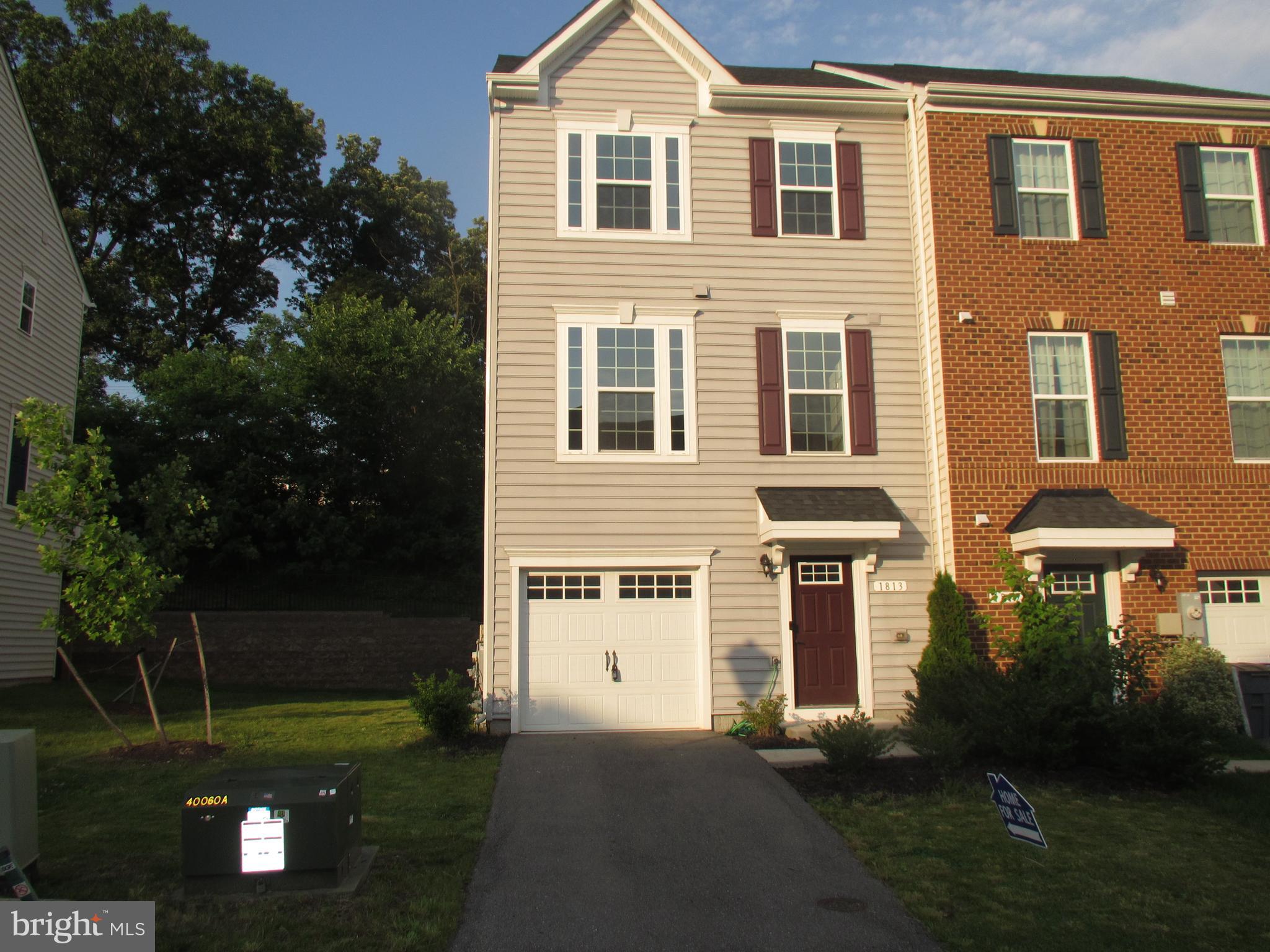 This Beethoven at Highgate Village is a luxury 3-story end unit townhome built to buyers' specifications. Entry level includes Foyer, finished Recreation Rm with walkout to back yard, 2-piece rough-in and access to the 1-car Garage. Main living level has Living Rm; Powder Rm; and Kitchen with Dining area, large island, granite countertops, backsplash, pantry, and GE SS Appliances including refrigerator. Upper level includes the Owner's Ste with walk-in closet and private bath.