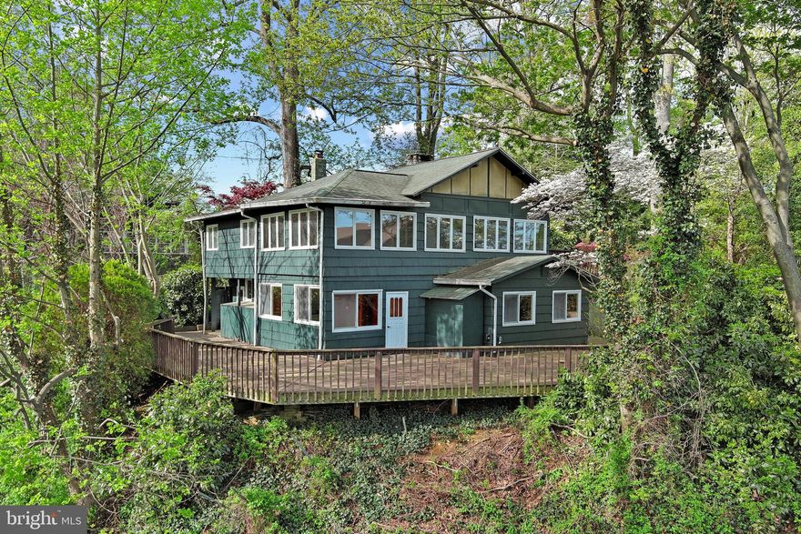 Nestled on a hillside overlooking the Severn River, this property presents a rare opportunity in the highly coveted Sherwood Forest community. Set on a private lot, the home offers a great balance of indoor and outdoor living. A spacious deck provides the perfect setting to relax or entertain while taking in views of boats passing along the river.  The home features just over 2,700 square feet, with 4 bedrooms and 2.5 bathrooms, offering plenty of space to enjoy as-is with the opportunity to renovate or rebuild at a later date. Whether you’re looking for a place to experience Sherwood Forest summers or envision building your dream water-view home, this property offers exceptional potential.  Sherwood Forest is a prestigious gated community comprising 341 residences. Residents enjoy access to a plethora of amenities including a spacious multi-purpose Club House, General Store, 9-Hole Golf Course, 6 Tennis Courts, Marina, Beaches, Swimming Pool, Basketball Court, Bowling Alley, Pickle Ball Courts, Archery Pit, Nature Lab, and a renowned Children’s Summer Camp Program. Numerous fields throughout the neighborhood cater to various sports such as Lacrosse, Soccer, Football, Softball, Volleyball, and Badminton. The surrounding forest boasts over 5 miles of scenic walking and mountain biking trails, with a picturesque 2-mile waterfront loop offering captivating views of the Severn River and Brewers Pond. Golf carts are the preferred mode of transportation within the community. The vibrant social calendar is filled with events including the 3rd of July Fireworks, 4th of July Parade, Summer Dances, 5K Race, Corn Roast, Clam Bake, Tennis and Golf Tournaments, and much more. Holiday festivities cater to both adults and children alike. A one-time $20,000 membership fee to join the Sherwood Forest Club is required as part of your Real Estate Transaction.