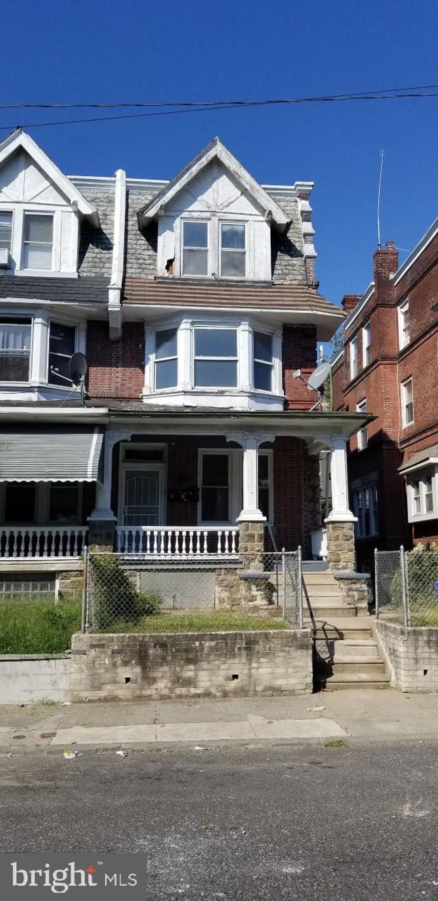 This three story apartment building has separate utilities.  It has 3 gas heaters and 3 gas hot water tanks all located in the basement.   Each floor has one bedroom, living room, dining room, kitchen, bathroom and a den.  The building is currently vacant. Sell AS-IS condition.