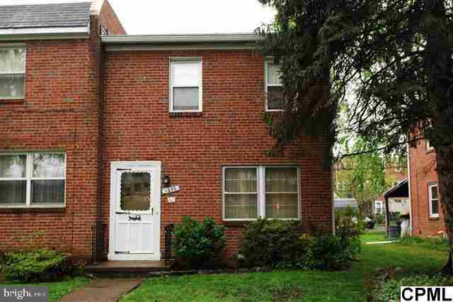 Move-in condition end-unit brick townhome with 3 bedrooms, spacious living and dining rooms, new gas furnace & water heater, updated electric, newer kitchen cabinets, hardwood under all carpet, some replacement windows. Relaxing rear porch and cute landscaped rear yard with shed and off-street parking.