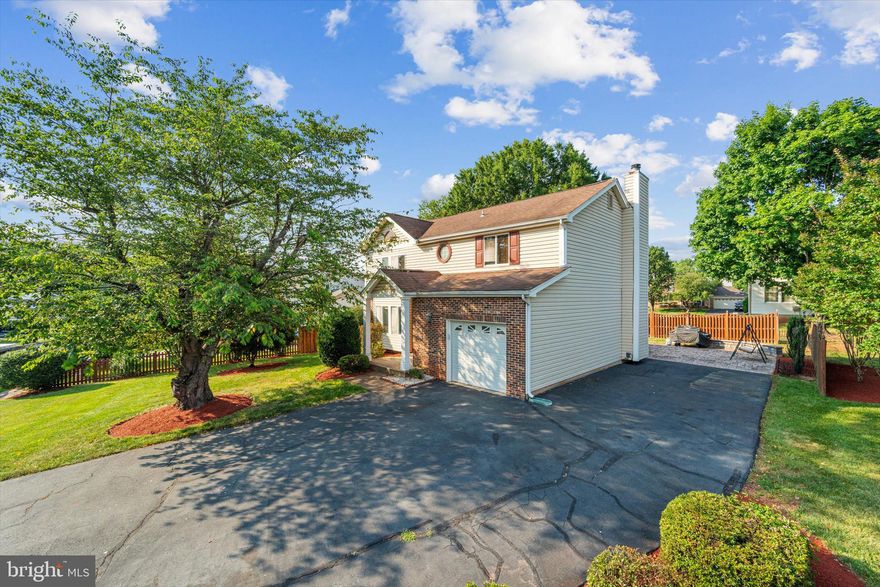 Do you have an RV, boat, or commercial vehicle? Don't miss this opportunity to own this house with an extended driveway and no HOA. Welcome to your dream home in the heart of Manassas! This single-family residence is perfectly situated in a private cul-de-sac on a generous 0.29-acre lot. Featuring 4 bedrooms and 2 full bathrooms on the top level, there is plenty of space for family and guests. The large Master Bedroom is a true retreat, boasting vaulted ceilings, a walk-in closet, and a private bathroom with double sinks for added convenience. Three secondary bedrooms are all spacious with generous closet space and they share the hall bath. The stacked full-size washer and dryer are also located on the upper level making laundry day a breeze. The main level has formal living & dining rooms and a family room with wood-burning fireplace. The basement is a blank canvas, offering plenty of storage or opportunities for your custom finishes, complete with rough-in for an easy bathroom installation. Step outside and relax on the beautiful paver patio (43.5' x 20') with built-in seating walls, or soothe your senses and sore muscles in the included hot tub under the charming covered pergola. The expansive driveway is large enough for an RV or boat. There is also a 30 AMP plug on the side of the house for RV hookup. And remember, no HOA! This home is surrounded by a beautifully landscaped yard featuring crepe myrtle trees, azalea bushes, burning bushes, a cherry blossom tree, a Japanese maple, and fresh mulch. Storage solutions in this home are plentiful: Built-in storage in the basement, large 10x14 shed, and garage storage built overhead. The garage also has a workbench and 2nd refrigerator.  This home is conveniently located with easy access to the by-pass, historic Old Town Manassas, shopping, and VRE, making it the ideal place to enjoy both comfort and convenience. Don’t miss this incredible opportunity to make this beautiful house your new home! Carrier heat pump HVAC system installed in May 2021.