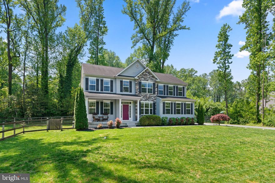 **OFFER DEADLINE, SATURDAY, MAY 11 @ 4:00 PM**Welcome home to this gorgeous 2015 built colonial home on .57 acres.  The classic design features a side-loading two-car garage, offering convenience and curb appeal. A separate shed/garage provides extra storage space for outdoor equipment and tools. The adorable front porch is the perfect place to enjoy morning coffee. As you step inside, you're greeted by a grand two-story foyer, boasting an impressive architectural feature that sets the tone for the rest of the home. Gleaming hardwood floors span the majority of the main level, adding elegance and durability. To the left of the foyer is a spacious living room, perfect for entertaining and relaxing. Adjacent to the living room is a formal dining room, providing an elegant space for hosting dinner parties and special occasions. The heart of the home is the modern eat-in kitchen, featuring granite countertops, an island for additional workspace, and stainless steel appliances. A sliding glass door leads to a Trex deck with pergola and a patio, offering a seamless indoor-outdoor living experience. Connected to the kitchen is a cozy family room, complete with a gas fireplace, creating a warm and inviting atmosphere. Conveniently located off the kitchen, the mudroom provides access to the garage, making it easy to unload groceries and keep the main living areas organized. A main-level office offers a private space for work or study and a powder room is great for guests. Ascending the staircase, you'll find a well-appointed upper level featuring brand new carpet! The luxurious primary suite boasts two closets and a spa-like bathroom with a soaking tub, separate shower, and dual vanity, providing a tranquil retreat after a long day. Three additional spacious bedrooms offer ample space for family members or guests. A second full bath on the upper level ensures convenience for the entire household. The upper-level laundry adds convenience to daily chores. The fully finished basement extends the living space and provides versatile options for entertainment and recreation. A spacious family room with a gas fireplace serves as a cozy gathering spot for movie nights or relaxation. The basement features an impressive bar area, perfect for entertaining guests or enjoying drinks with friends. A hidden nook behind a moving bookshelf adds intrigue and functionality, offering discreet access to TV wires, electronics, and storage. A spacious bedroom with access to the outside provides flexibility and convenience for guests or family members. A full bath with marble finishes adds luxury and convenience to the basement level. An extra room in the basement can be used as a wood shop or home gym, catering to various hobbies and interests. The backyard is a private retreat, featuring a level, fenced yard with wooded surroundings, offering tranquility and privacy for outdoor activities and relaxation. Located just minutes from shopping, dining, grocery stores, and major commuting routes to Crofton, Annapolis, Baltimore, and Washington, DC, this home offers both convenience and luxury living. Don't miss the opportunity to make this your dream home!