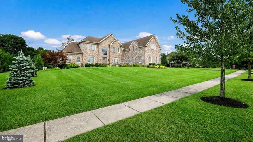 Welcome to 2791 Manion Way, a masterpiece of elegance and sophistication nestled in the coveted Spring Valley Estates. Set on a beautifully landscaped acre, this exceptional residence combines luxury with comfort, offering stunning views of manicured gardens and mature trees. As you enter through the grand foyer, you’re greeted by refined moldings and gleaming hardwood floors. The formal Dining Room and inviting Living Room set the stage for elegant gatherings, while the sun-drenched conservatory with its vaulted ceilings provides a charming retreat. The expansive Chef’s Kitchen is a culinary delight, featuring granite countertops, a tiered island, upgraded stainless steel appliances including a 6-burner range with griddle, dual ovens, an additional wall oven, and a cozy breakfast nook. This space seamlessly flows into the Family Room, highlighted by its soaring ceilings and an impressive floor-to-ceiling fireplace.
The private Study, with custom built-ins, offers a serene space for work or study. Upstairs, the luxurious Primary Suite serves as a private sanctuary with a fireplace, coffered ceilings, a cozy sitting area, custom walk-in closets, and a spa-like bathroom with a Whirlpool soaking tub, walk-in shower, and double vanity. Two additional bedrooms share a Jack and Jill bath, while a fourth bedroom with an en-suite bath completes the upper level. The finished Lower Level is designed for ultimate entertainment, featuring a custom wet bar, full bath, a dynamic workout room, and media areas perfect for movie nights and gatherings.  Outside, the property shines year-round with its expansive backyard, elegant hardscaping, and a custom-built Pavilion with a grill area, all set against picturesque wooded views. Additional features include a 3-car garage, an irrigation system, and a Generac generator. Located in the award-winning Central Bucks School District and just minutes from the charming towns of New Hope and historic Doylestown Boro, 2791 Manion Way offers not just a home, but a distinguished lifestyle.