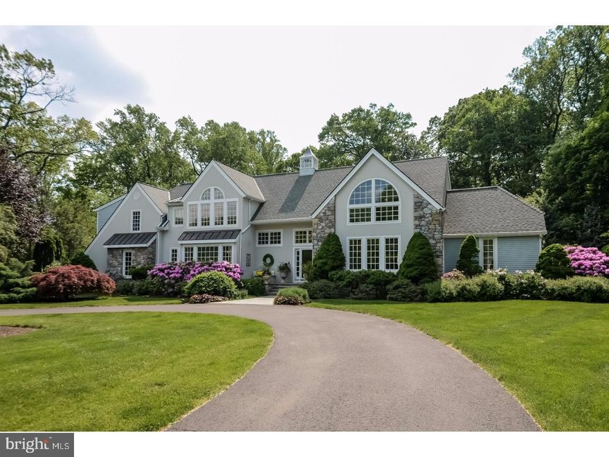 A winding driveway in an allee of 21 pin oak trees is prelude to a spectacular property w/stone, wood & stucco house surrounded by sweeping lawn & beautiful landscaping. Sophisticated charm describes this custom built home transformed by current owner from contemporary architecture to today's features & details. Nothing was spared to create a comfortable, elegant home for living & entertaining. Sip coffee in morning sun on spacious entrance while watching horses graze in adjoining horse farm pasture. Exceptional floor plan starts w/wide, 2-story foyer, whimsical powder room & view of stone fireplace in step down living room w/skylight in 20' ceiling. Serving areas w/sink, wine cooler & refrigerator lead to chef's kitchen w/2-color maple cabinetry, granite counters, MackenzieChild tile backsplash, island w/sink & seating plus butler's pantry w/wall oven, built-in desk unit, more cabinetry & window seat. Enjoy meals in front of kitchen windows that let in natural light & views of changing seasons. Dining room features trey ceiling & stencil painted walls. Relax in sunroom w/angled windows & gas fireplace shared w/living room. Step up into music room that is part of area once a master bedroom suite. Adjoining rooms are now used as family room, gym w/rubber matted floor & full bath. Main level also has mud room w/door to paver patio & another full bath convenient to in-ground, heated salt water swimming pool & spa. Stunning ambiance continues upstairs w/loft area, 5 bedrooms & 3 full baths. Master bedroom suite has sitting room w/views from Palladium window, 4 closets, tiled bath w/full height cabinetry, 2 sinks, whirlpool tub, tiled shower, dressing table, mirrored walls, separate toilet room. 3 other generous size bedrooms have large closets. Hall bath has tub/shower & toilet area, 2 vanities w/sinks, linen closet. 5th bedroom was added on & is multi-purpose suite for whatever your needs. Main room w/closet, smaller room & tiled bath w/shower could be office, nanny or in-law quarters or media & hobby rooms. Basement has large cedar closet, laundry room w/sink, cabinets & pull-down ironing board. High-ceiling unfinished area for storage & mechanicals, including 3-zone geothermal system for heating/cooling, 2 hot water heaters, water softening system. Whole-house sound system, 3-car garage w/separate storage area, security system.  Immaculate, move-in condition and an enviable location close to New Hope & shopping, dining & arts in Bucks County. Welcome home!