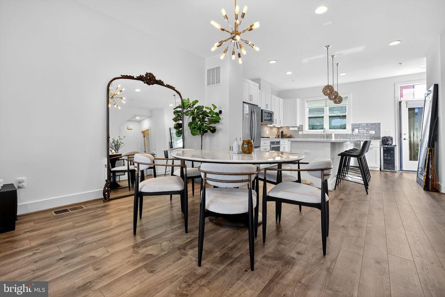 Experience the perfect blend of style, comfort, and convenience in this stunning four-level Bailey Model townhome by EYA, ideally situated in the highly sought-after Tower Oaks Community.
Bathed in natural light across every level, this 4-bedroom, 3.5-bath residence showcases an open-concept floor plan designed for modern living. The gourmet kitchen flows seamlessly into spacious dining and living areas, opening onto a private deck—perfect for entertaining or relaxing outdoors.
Upstairs, the third level features three bedrooms, including a versatile room currently designed as a custom walk-in closet that can easily be converted back into a bedroom. The fourth level offers a private retreat complete with a bedroom, full bath, and living area that opens to a rooftop terrace finished with high-end porcelain tile—an ideal setting for gatherings or quiet evenings under the stars.
Additional highlights include a two-car garage, two-zone HVAC system, plantation shutters throughout, and custom closets that elevate both style and functionality.
Residents of Tower Oaks enjoy access to every amenity imaginable, all included in the monthly HOA fee—featuring a state-of-the-art fitness center, yoga studio, Amazon hub, café, residents’ lounge, club room, swimming pool, sport court, playground, fire pits, and BBQ grills. The neighborhood is meticulously maintained and beautifully landscaped, with close proximity to major highways, shopping, dining, and entertainment.
Beautifully maintained and thoughtfully upgraded, this exceptional home embodies modern brownstone living at its very best.