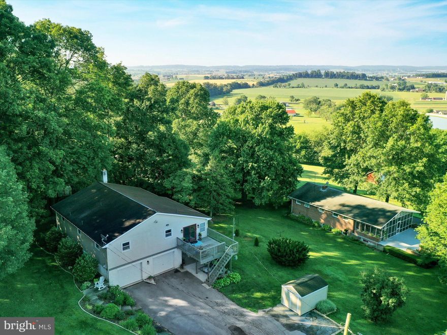 That view though!  This picturesque setting on Himes Hill in Earl Township is sure to take your breath away!  Featuring 3 bedrooms and 2 full bathrooms and nestled on .6 acres!  Upper level was completely remodeled in 2019 to create a beautiful open floor plan! Gorgeous kitchen boasts new appliances, granite countertops, stone backspash, soft close cabinets, large island with breakfast bar, recessed and pendant lighting, luxury vinyl plank flooring, built in desk/coffee bar and bench with storage! Large Living room/sunroom boasts a wall full of windows perfect for entertaining and enjoying the view!  Huge primary bedroom with wooden lined walk in closet!  HVAC replaced in 2017! Lower level bath with newer walk in tiled shower! New water heather in 2020! Water filtration system by Haller with water softener and acid reducer! Large Swim Spa included in sale.  This is a must see, and won't last long!