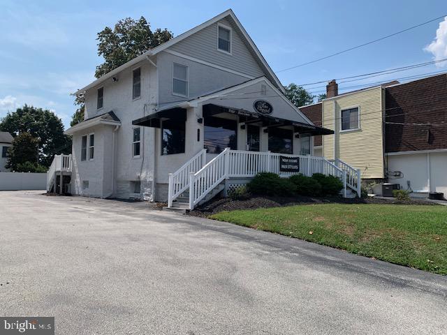 REAL ESTATE ONLY. List Price does not include the existing business. Currently tenant occupied as a hair salon/spa. Approximately 20 Parking Spaces, 3-story building, restrooms, full basement for storage. Call Listing Agent for more details.