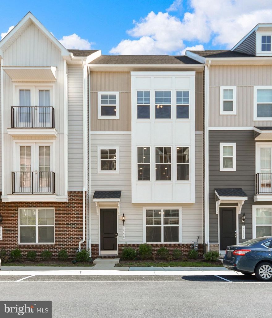 Exceptional value!    Must see this gorgeous Kempton I with Loft, Suite and rooftop deck, where clean lines, thoughtful design, and low-maintenance living come together in one of Frederick’s most desirable new communities.
This is not your average townhome. It’s full homeownership, set within a condo-style community, so you get the freedom of owning your home, with fewer headaches and many shared perks.
Built in 2024 and barely lived in, this four-level stunner checks every box. From the custom upgrades to the high-end finishes, it delivers the look, the function, and the feel today's buyers want, without the new construction wait or price tag.   The bonus lofts are rare, and were sold by the builder at a premium price, but seller is passing theirs through at an amazing value!
Upon entry, there's a private suite with full bath.  Perfect for guests, in laws, your work-from-home setup, or a quiet retreat. The rear-load two-car garage adds convenience and security and no detail is overlooked.
Upstairs, the main level is a showpiece. Soaring ceilings. sunlight everywhere. crown molding. Designer lighting. The kitchen is absolute perfection!   A gourmet setup with stainless steel appliances, quartz counters, crisp shaker cabinets, gas cooktop, double wall ovens, walk-in pantry, and an island that says, "Come in and stay a while." It flows right into a spacious dining area and open living space ideal for entertaining.
The third level features your primary suite retreat, fit for a king-sized bed and then some, with a large walk-in closet and spa-inspired bath with dual vanities and a glass walk-in shower. Two more bedrooms, another full bath, and laundry complete the level with both function and flair.
The top-level loft is the crown jewel,  complete with a wet bar, dedicated mini-split HVAC, and access to your own private rooftop terrace. Morning coffee, evening cocktails, weekend grilling, this is indoor-outdoor living at its best.
Located just minutes from shopping, dining, Wegmans, and the charm of Downtown Frederick, plus easy commuter access to I-70, I-270, and the MARC train. Trails, parks, and green spaces are right outside your door.
This is more than a home. It’s a lifestyle.  Turnkey, tasteful, and totally ready for you. Garage is even EV-ready!  
2558 Hopton Lane, come see what modern living was meant to be.