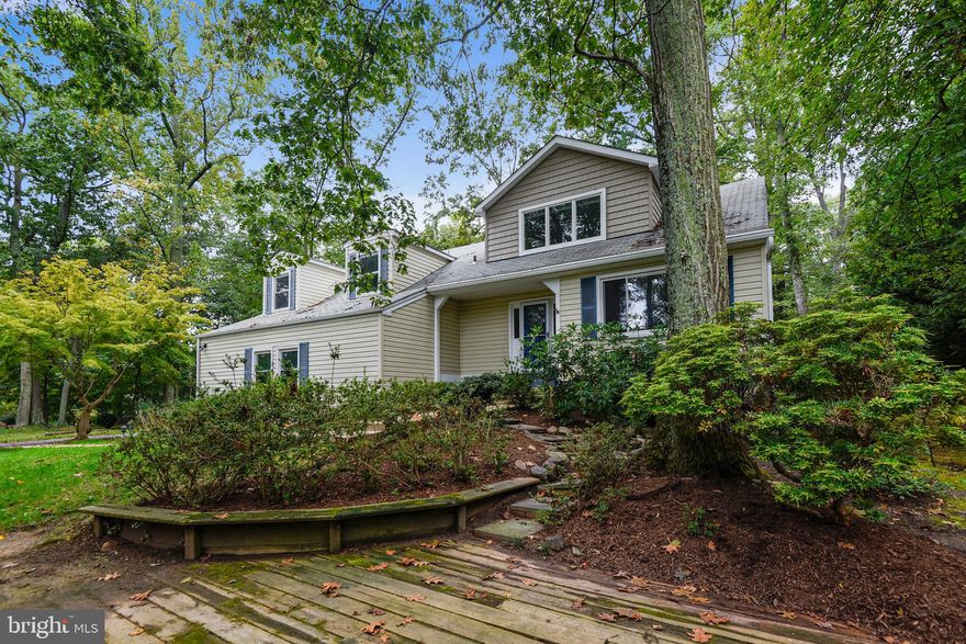 Come by this lovely, updated 4 Bedroom 3.5 bathroom home in the Annapolis Roads community of Annapolis. This home features a renovated Kitchen with white shaker style cabinets, granite counters, and stainless steel appliances, hardwood floors throughout the home, updated bathrooms and more. There are two master suites in this home with attached baths, one is a try luxury bathroom with dual sinks, separate tub and stall shower and walk in closet.  This home offers much more including a large two car garage, deck off the main level, deck in the front yard and more. You'll love living in Annapolis Roads, this water front community which offers it's residents water access, community beach, playground and more. ****Open house requires appointment and registration, make your appointment and register at http://OpenHouse.davidjmoore.net *******