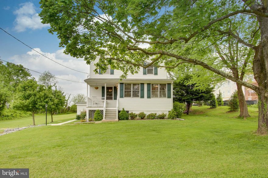 This charming 3 bed, 2 bath 2000 sq. ft. colonial sits on just under a half acre of beautiful green space.  Mature trees offer shade and perennial gardens frame the inviting outdoor spaces.  From new sidewalks, rock walls, lighting, trex decking, patio and pergola, nothing is left undone.The newly painted interior matches the meticulous care of the exterior. Refinished hardwoods on the first floor extend from the spacious family room with a gas fireplace to the renovated kitchen/dining area to the convenient home office tucked away in the light filled front corner of the house. Renovated bath with a first floor bedroom complete the space.New carpet leads upstairs to a very spacious master bedroom suite with a newly renovated master bath plus an additional bedroom.Lastly, the location excels with neighborhood access to Gough Park to one side and a walking path through green space leading to Honeygo Village Center on the other. Convenient to library, playground, schools, roadways and amenities yet still exuding that sought after sense of privacy.  Welcome to 9136 Rexis Ave.!