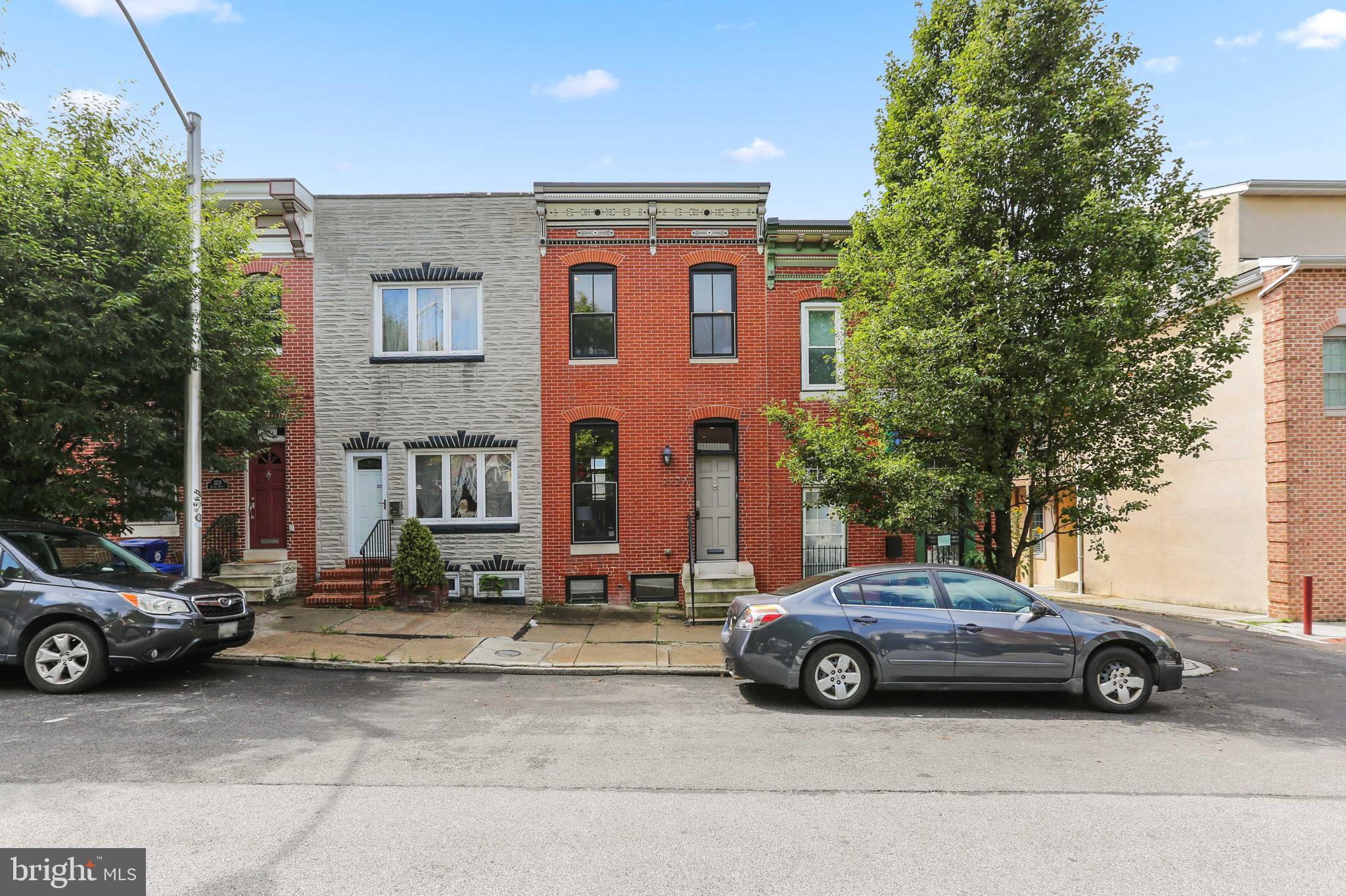 Spacious, updated home just steps from fabulous Patterson Park. The beautiful brick front exterior welcomes you into this home that offers the perfect mix & warmth of exposed brick walls and wood floors combined with modern amenities and updates that cater to today's lifestyle. The open floor plan of the main level offers a large living room with tray ceiling, a dining room, access to rear deck and patio, and an updated kitchen with stainless steel appliances, breakfast bar, and granite countertops. You'll love the smartly designed layout of the upper level that is great for sharing with a roommate or houseguest with two large bedrooms and two updated full bathrooms. The primary bedroom has double closets and the en suite bathroom includes a giant custom built walk in shower with body sprays. The finished lower level includes the third bedroom, and a bonus room/flex space that could be used as a family room/den, 4th bedroom, at-home office, studio/hobby room, education space, etc. Expand your living space outdoors on the large newly painted roof deck- a great spot for star gazing, watching fireworks, or entertaining. Located on a charming tree lined street, with Patterson Park at your doorstep and within an easy stroll to Johns Hopkins Hospital, the waterfront, and the dining, shopping, and nightlife of Fells Point & Canton.