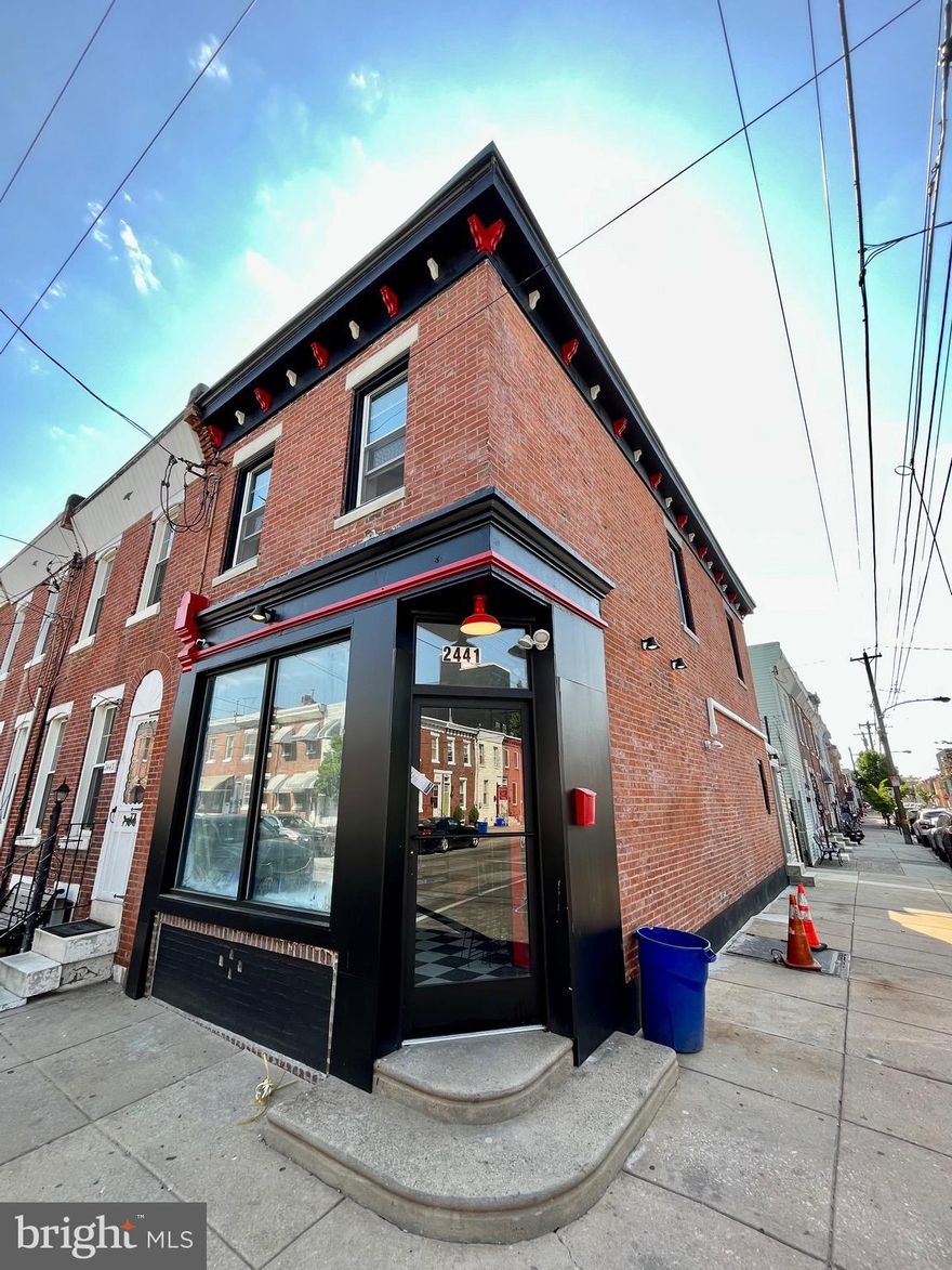 Unique opportunity in a prime Fishtown location!    This corner building consists of a 1st floor commercial space, full basement and a second floor one bedroom apartment.   This entire building has been gutted to the studs, expanded and renovated.   1st floor is currently a fully operating deli/grocery store.   This unit has brand new commercial windows + doors, fire suppression system + alarms,  new electric, plumbing and Hvac.   A rear addition has been added that provides ADA bathroom + storage.   This unit has a fully operational commercial kitchen w/ new range hood, exterior ventilation + ANSUL system.   A gated rear patio provides additional storage for the unit and has new iron staircase that leads to the 2nd floor apartment.   The apartment is bright + airy and has a new kitchen, bathroom, + laundry area.   LED recessed lighting, new hardwoods, new paint, doors, windows + trim.   Good size rear deck comes w/ the unit.    All construction is up to Philadelphia commercial code, making this a turn-key opportunity.    An owner-operator could live above the commercial unit or continue to collect headache free income.    Contents of 1st floor are negotiable.  All units have been separately metered.  There is nothing left to do but bring your business !!